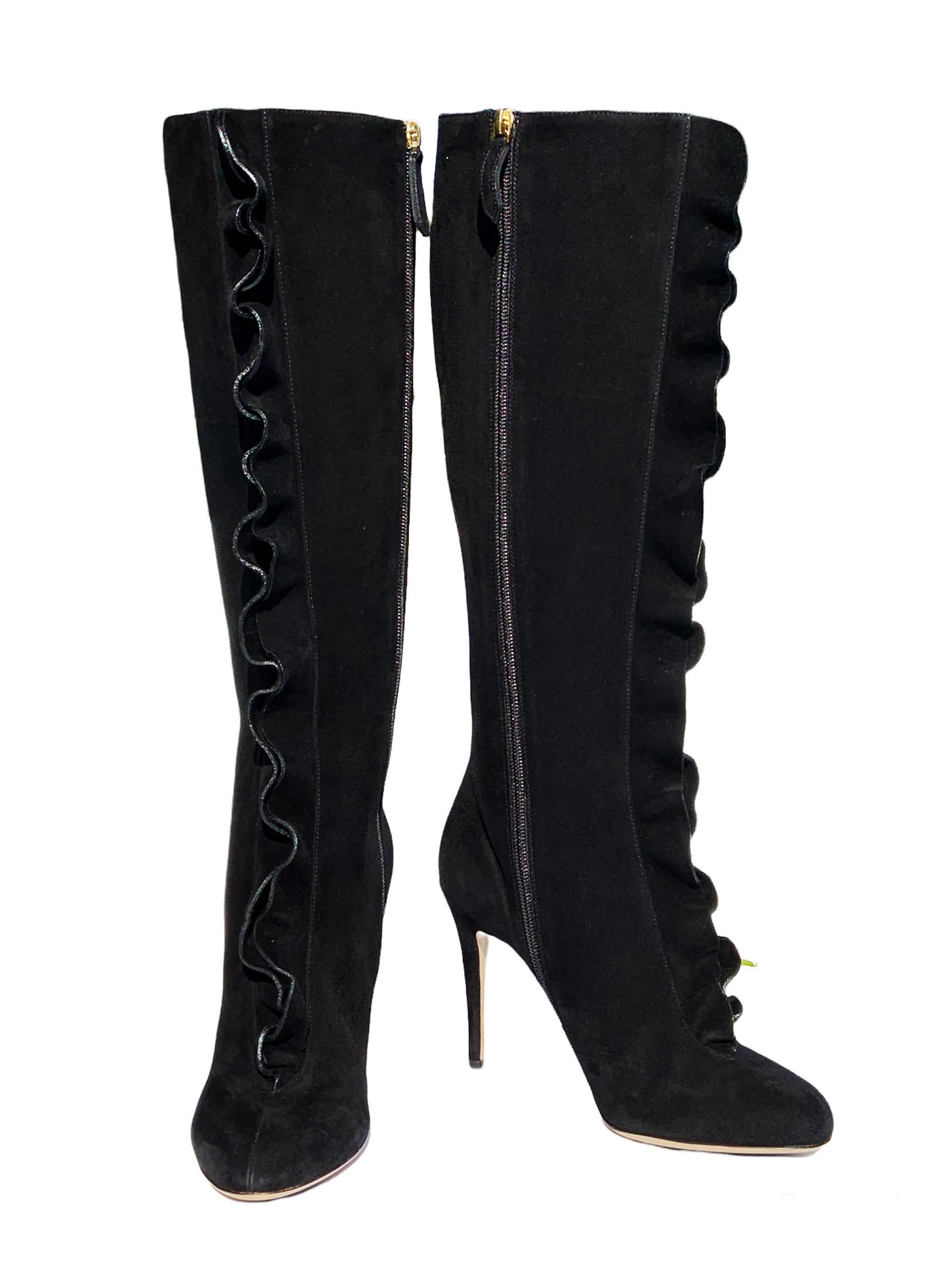 These suede Valentino boots feature a streamlined silhouette, with a textural double-ruffled front. 
Black suede upper, Two ruffles trim front, To-the-knee shaft, Round toe.
Side zipper for ease of dress. 4 inches covered heel.
Made in Italy.
New