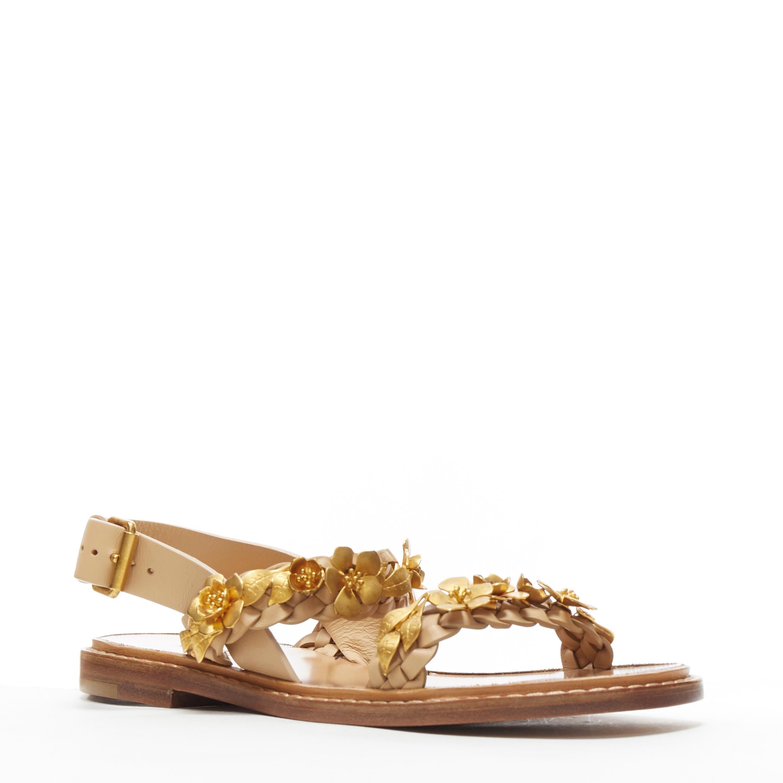 new VALENTINO tan brown braided gold metal flower embellished sandals EU35.5
Brand: Valentino
Model Name / Style: Floral sandals
Material: Leather
Color: Brown
Pattern: Floral
Closure: Strap
Extra Detail: Gold-tone floral leaf metal embellishment on