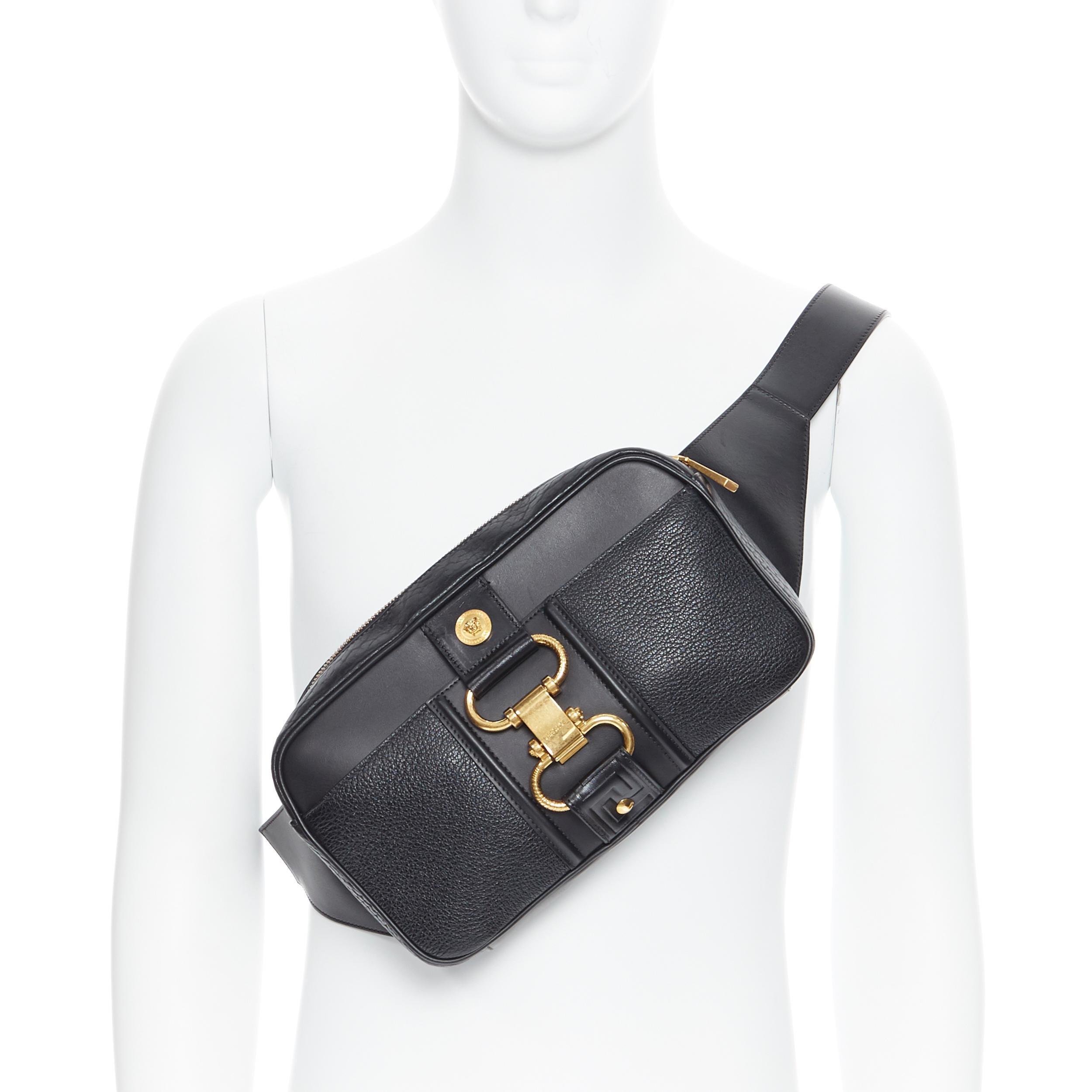 new VERSACE 2019 Runway black leather clasp buckle Medusa crossbody belt bag 
Reference: TGAS/B00070 
Brand: Versace 
Designer: Donatella Versace 
Model: Leather waist bag 
Collection: Fall Winter 2019 Runway 
Material: Leather 
Color: Black