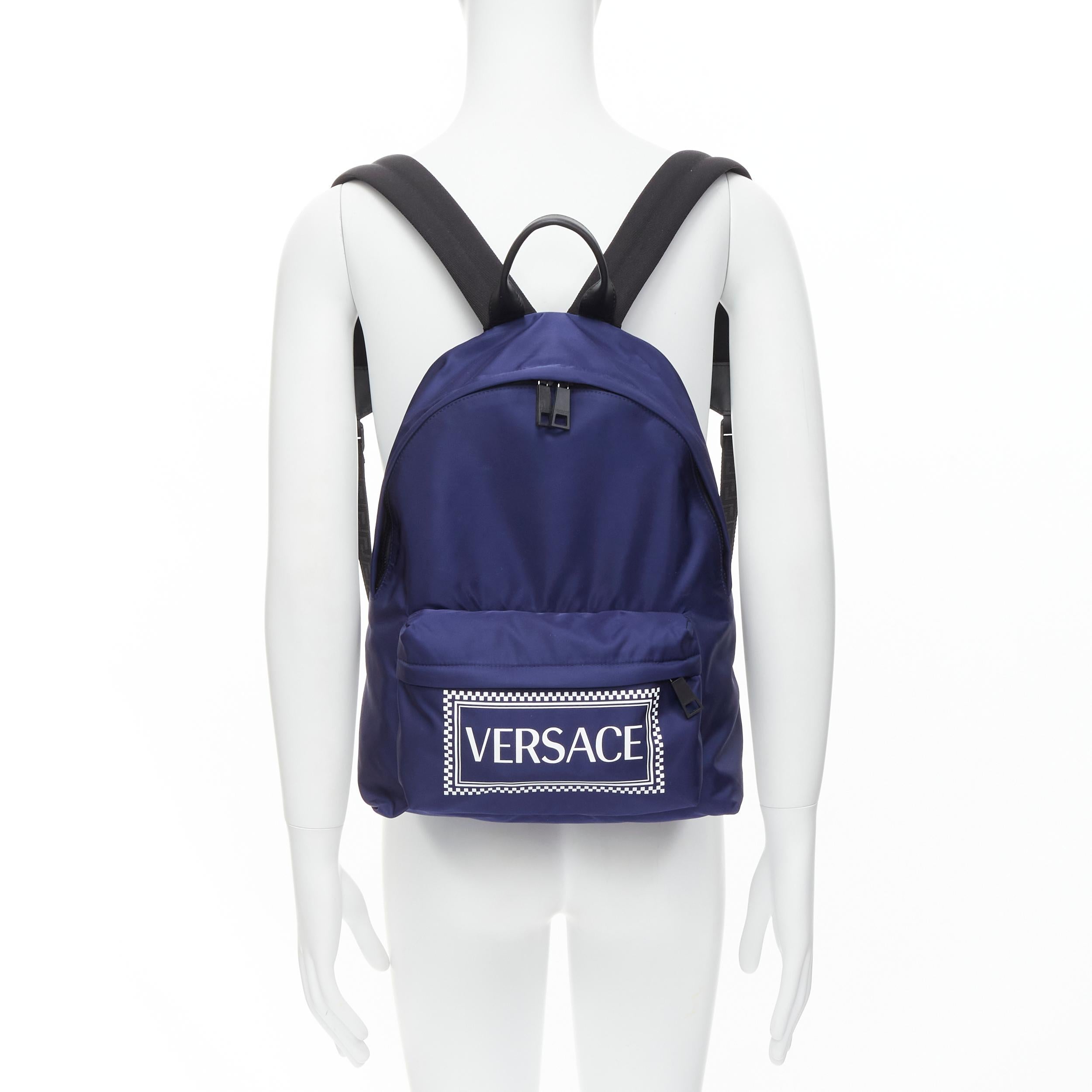 new VERSACE 90's Box Logo navy blue nylon Greca strap backpack 
Reference: TGAS/C00304 
Brand: Versace 
Designer: Donatella Versace 
Model: DFZ5350 DNYVER K88BN 
Collection: 90's Logo Collection 
Material: Nylon 
Color: Navy 
Pattern: Solid