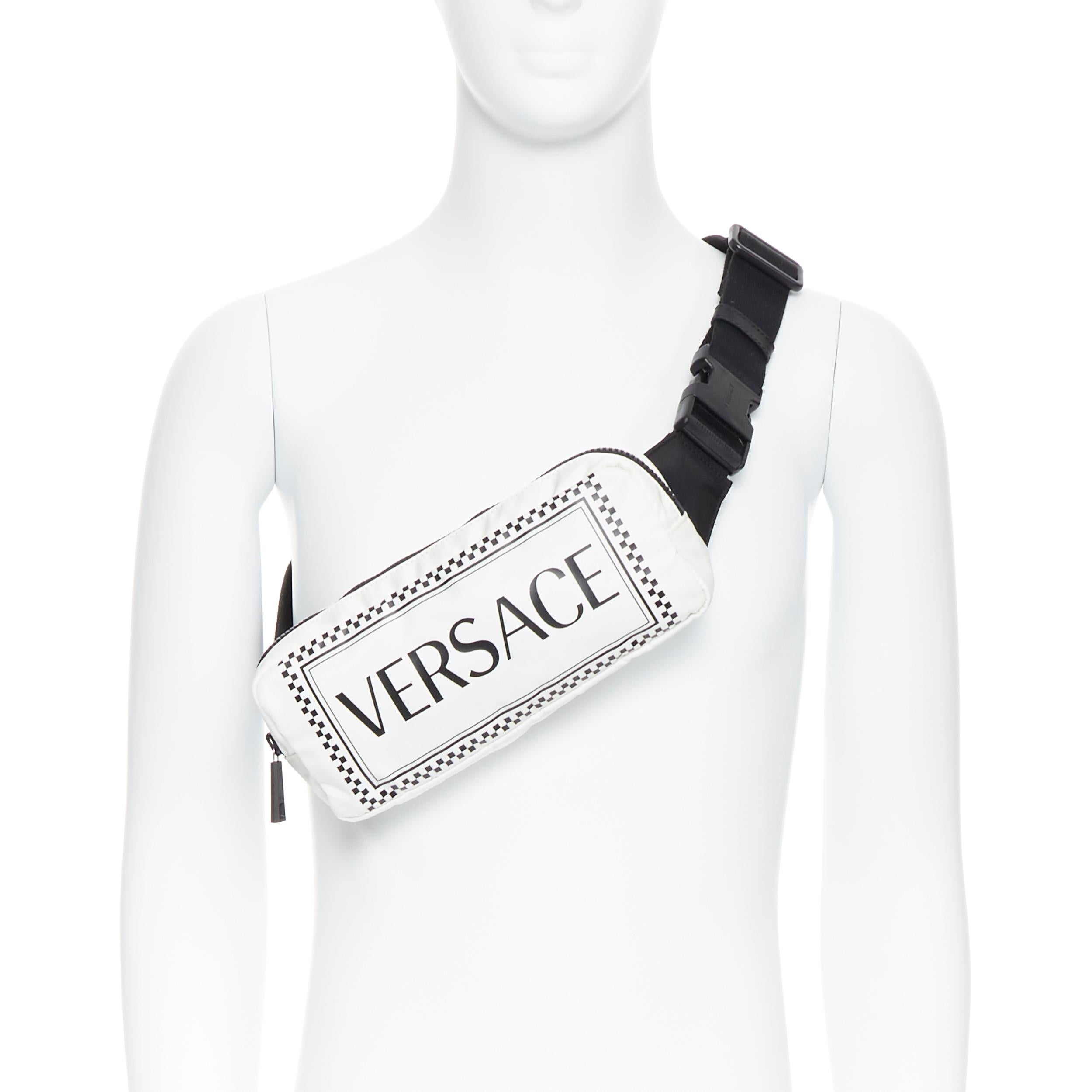 new VERSACE 90's vintage box logo print white nylon crossbody waist belt bag 
Brand: Versace
Designer: Donatella Versace
Collection: Fall Winter 2019
Model Name / Style: Belt bag
Material: Nylon
Color: White
Pattern: Solid
Closure: Zip
Extra Detail: