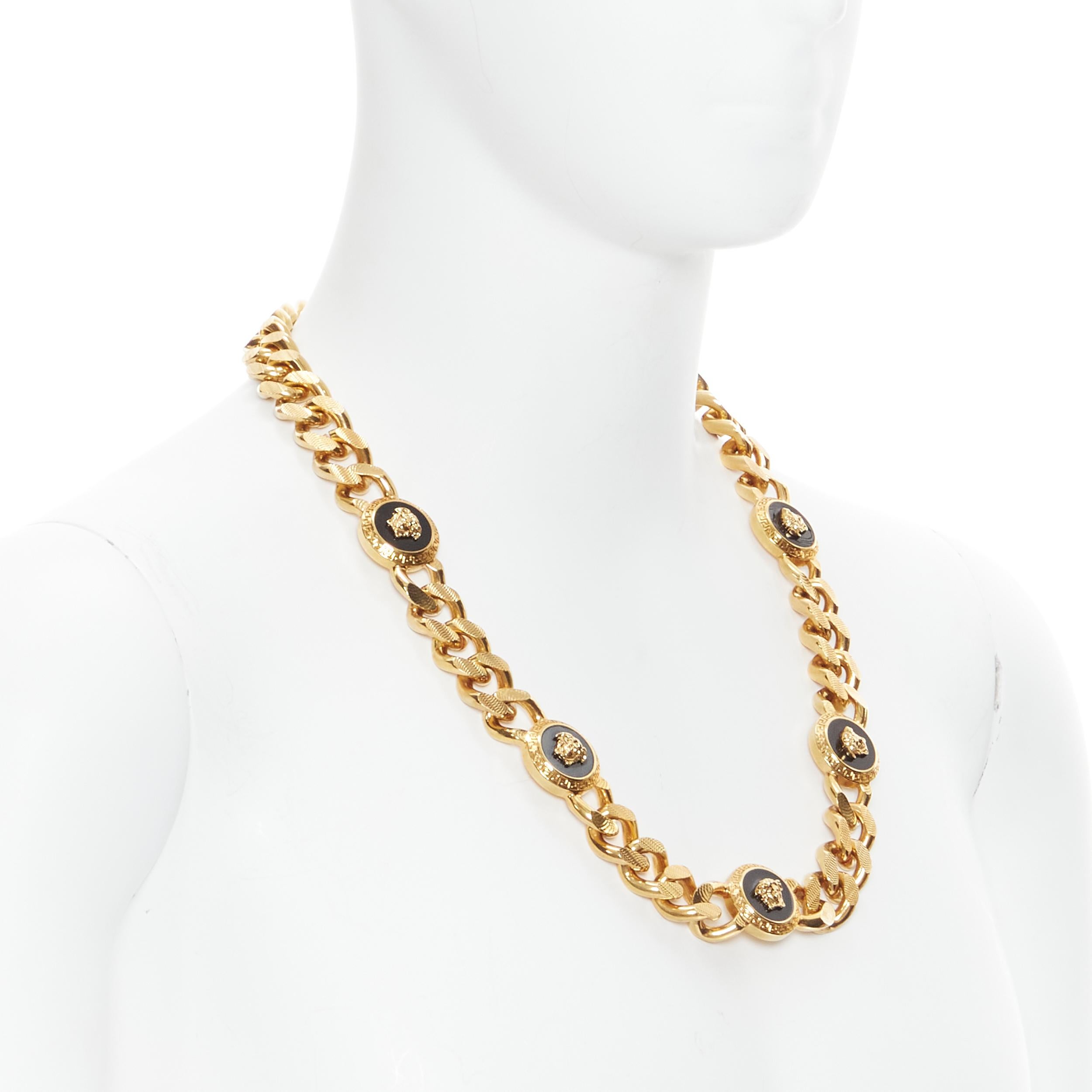 new VERSACE antique gold nickel black enamel Medusa coin gold cuban chain 
Reference: TGAS/B01504 
Brand: Versace 
Designer: Donatella Versace 
Material: Nickel 
Color: Gold 
Pattern: Solid 
Extra Detail: No closure clasp. Chunky curb chain link