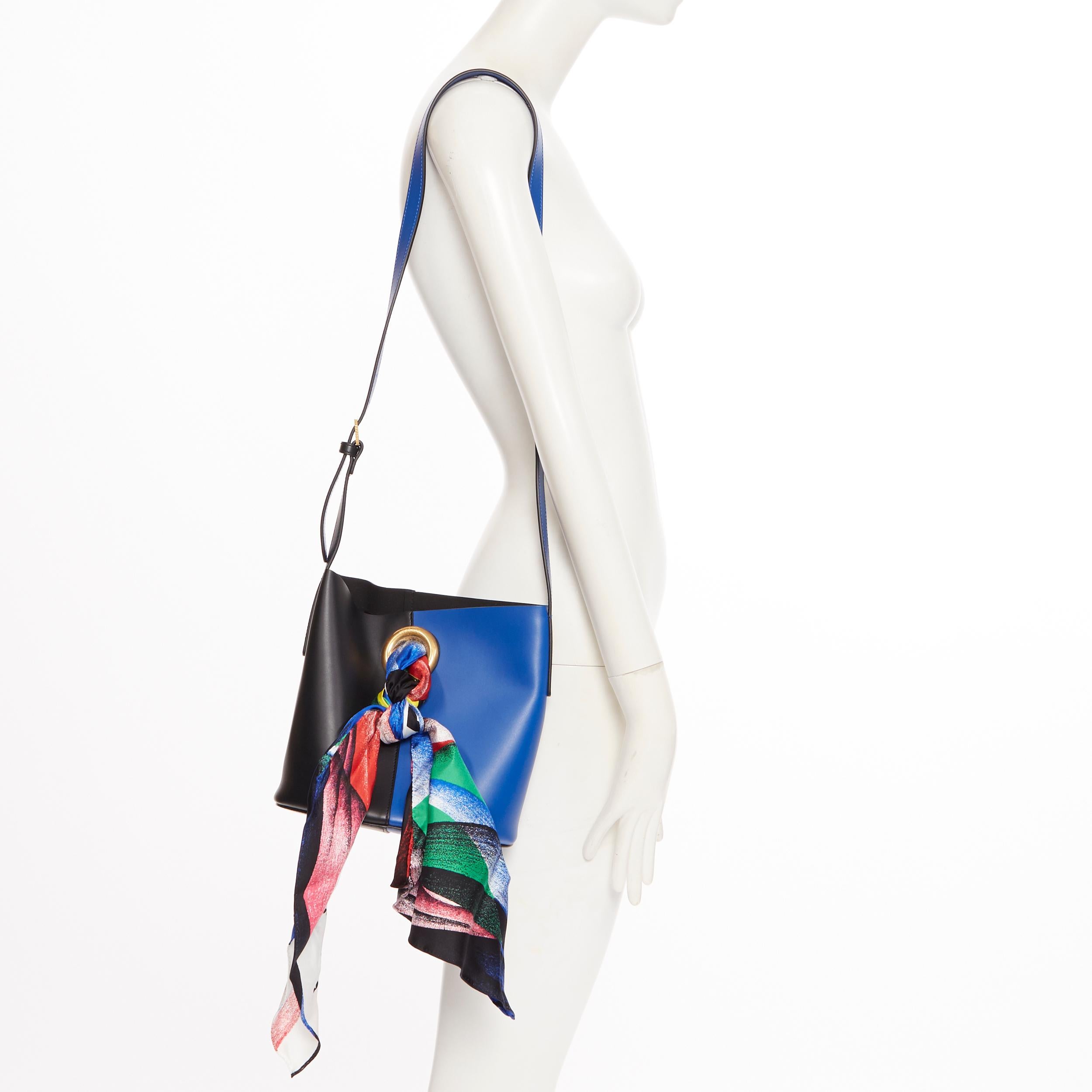 new VERSACE AW18 blue black calf leather Boccioni silk scarf tie bucket bag
Brand: Versace
Designer: Donatella Versace
Collection: Fall Winter 2018
Model Name / Style: Scarf tie bag
Material: Leather; smooth calf leather
Color: Black and