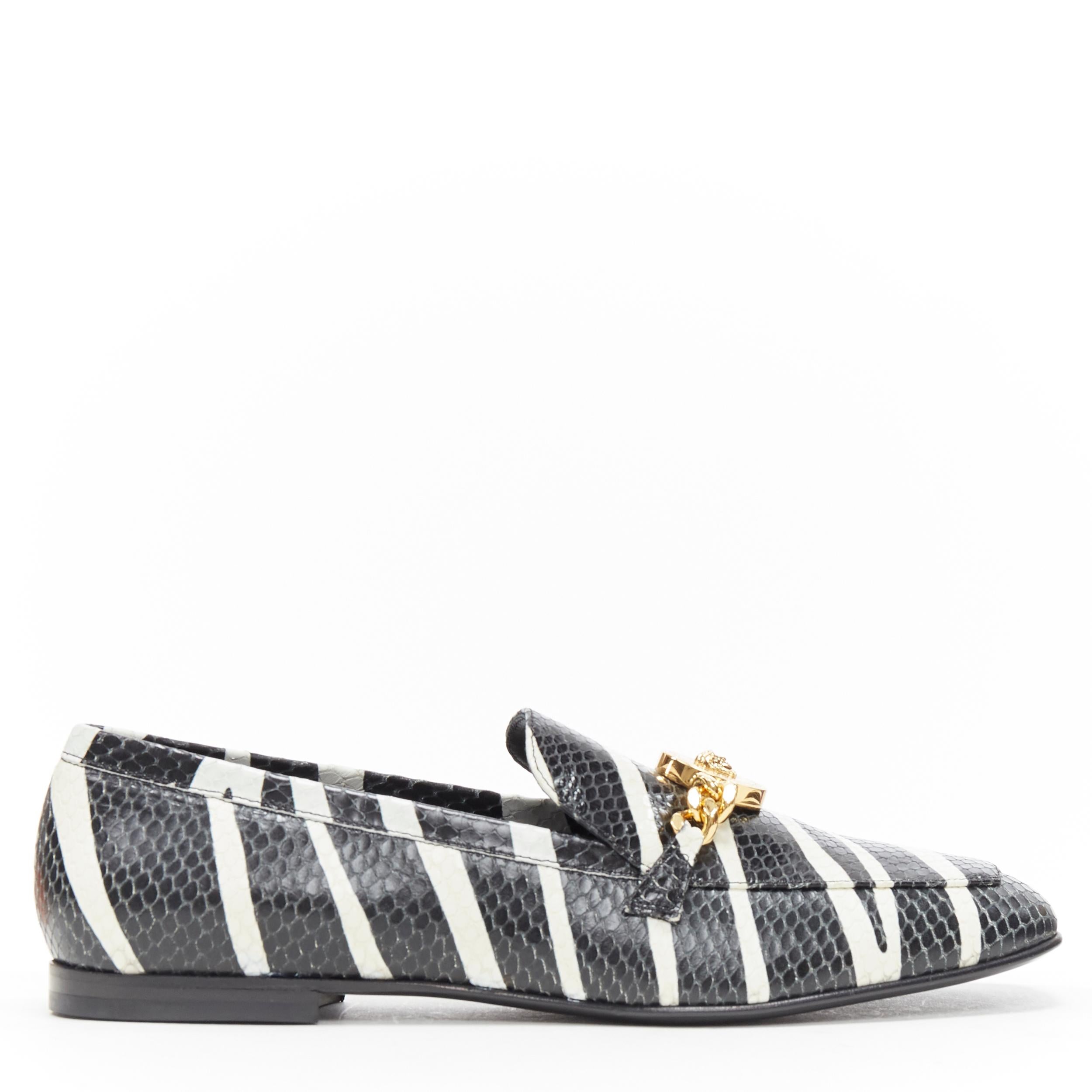 new VERSACE AW19 zebra print scaled calf leather gold Medusa chain loafer EU38 
Reference: TGAS/A04304 
Brand: Versace 
Designer: Donatella Versace 
Model: Loafer 
Collection: Fall Winter 2019 
Material: Leather 
Color: Black 
Pattern: Animal Print