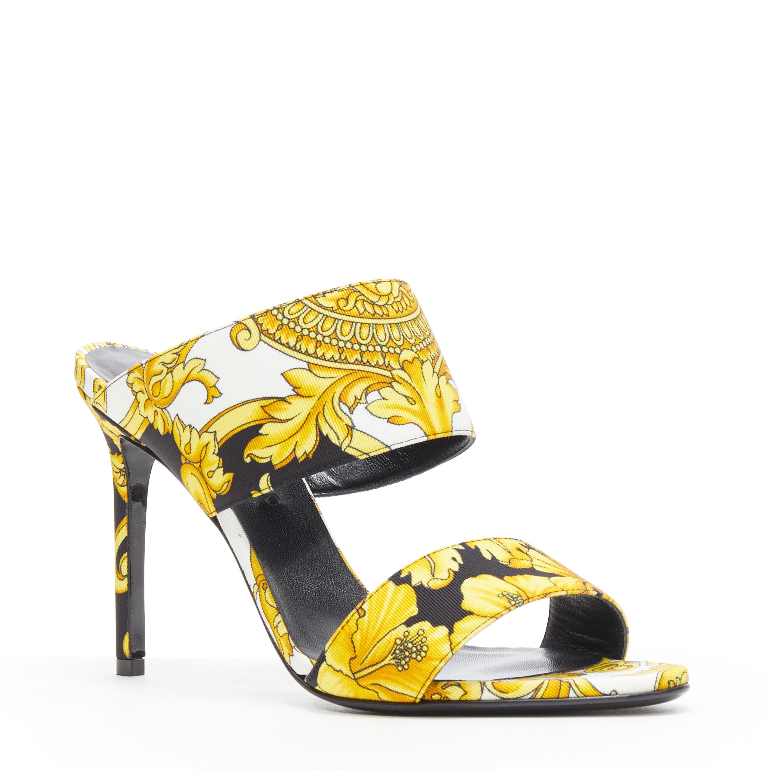 new VERSACE black gold Barocco Hibiscus print fabric open toe mule sandals EU38
Brand: Versace
Designer: Donatella Versace
Collection: 2019
Model Name / Style: Barocco mule
Material: Fabric
Color: Black, gold
Pattern: Floral
Extra Detail: Signature