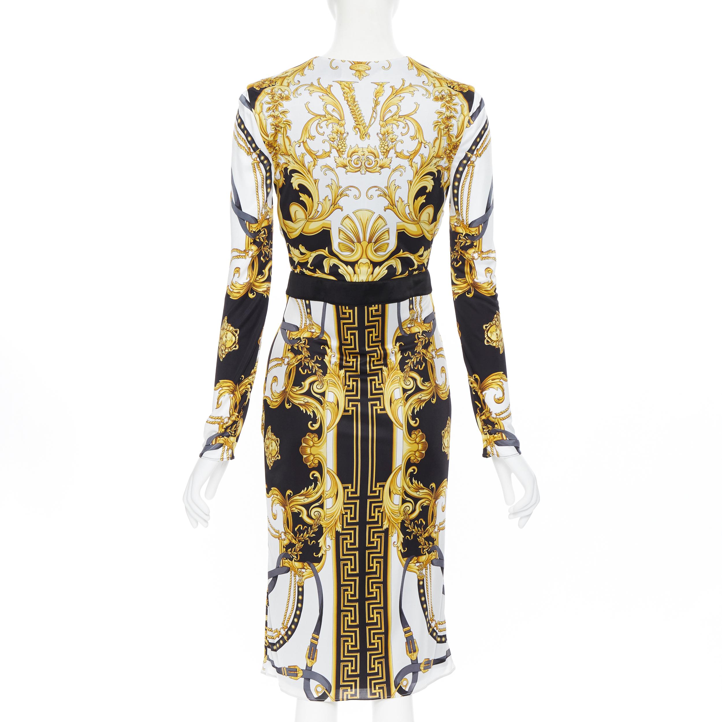 new VERSACE black gold baroque bondage strap virtus print wrap dress IT38
Brand: Versace
Designer: Donatella Verasce
Collection: SS2020
Model Name / Style: Wrap dress
Material: Viscose
Color: Gold, black
Pattern: Floral
Closure: Button
Extra Detail:
