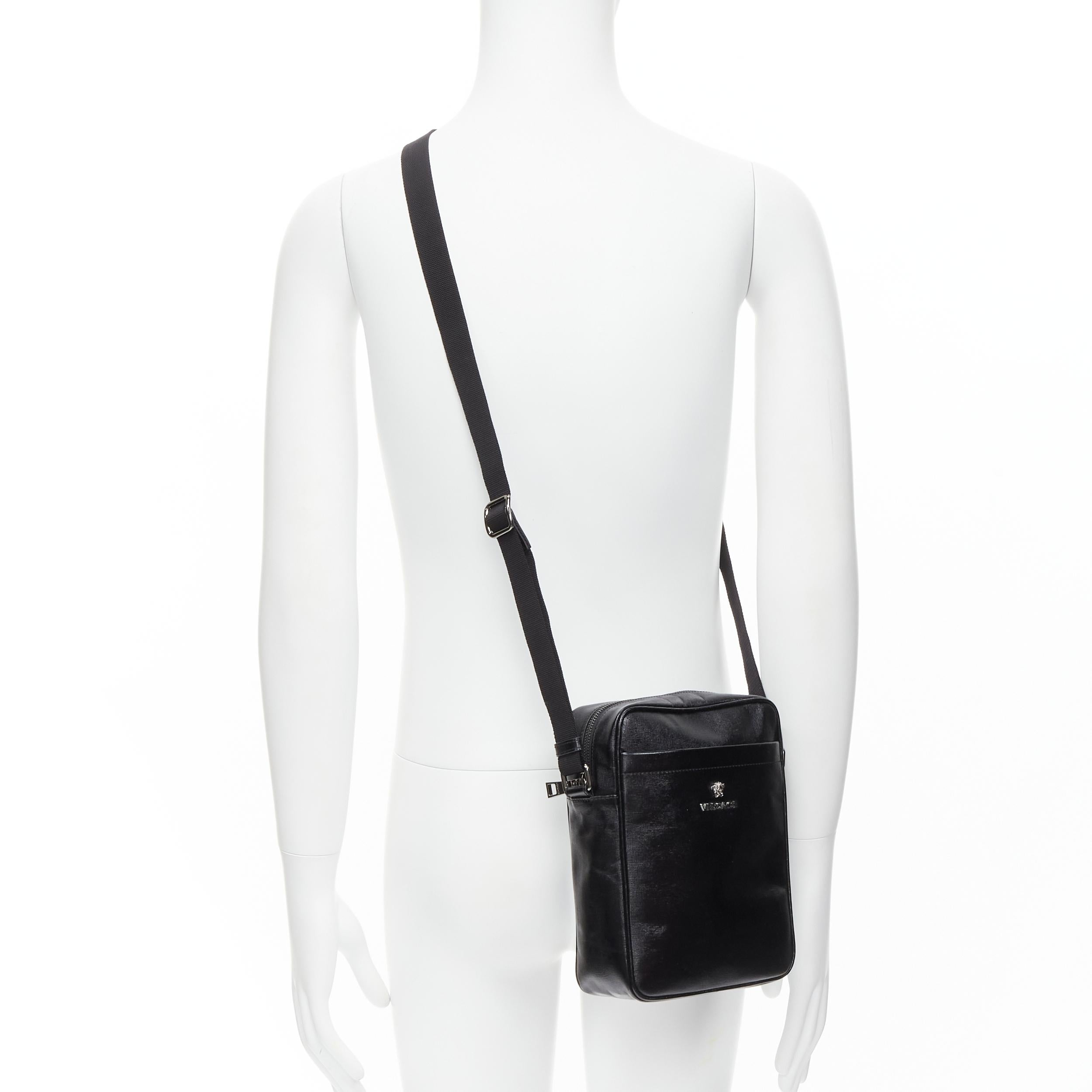 new VERSACE black lacquered saffiano leather silver Medusa crossbody bag 
Reference: TGAS/C00160 
Brand: Versace 
Designer: Donatella Versace 
Model: DL28125S DVIT2S D41E 
Material: Leather 
Color: Black 
Pattern: Solid 
Closure: Zip 
Extra Detail: