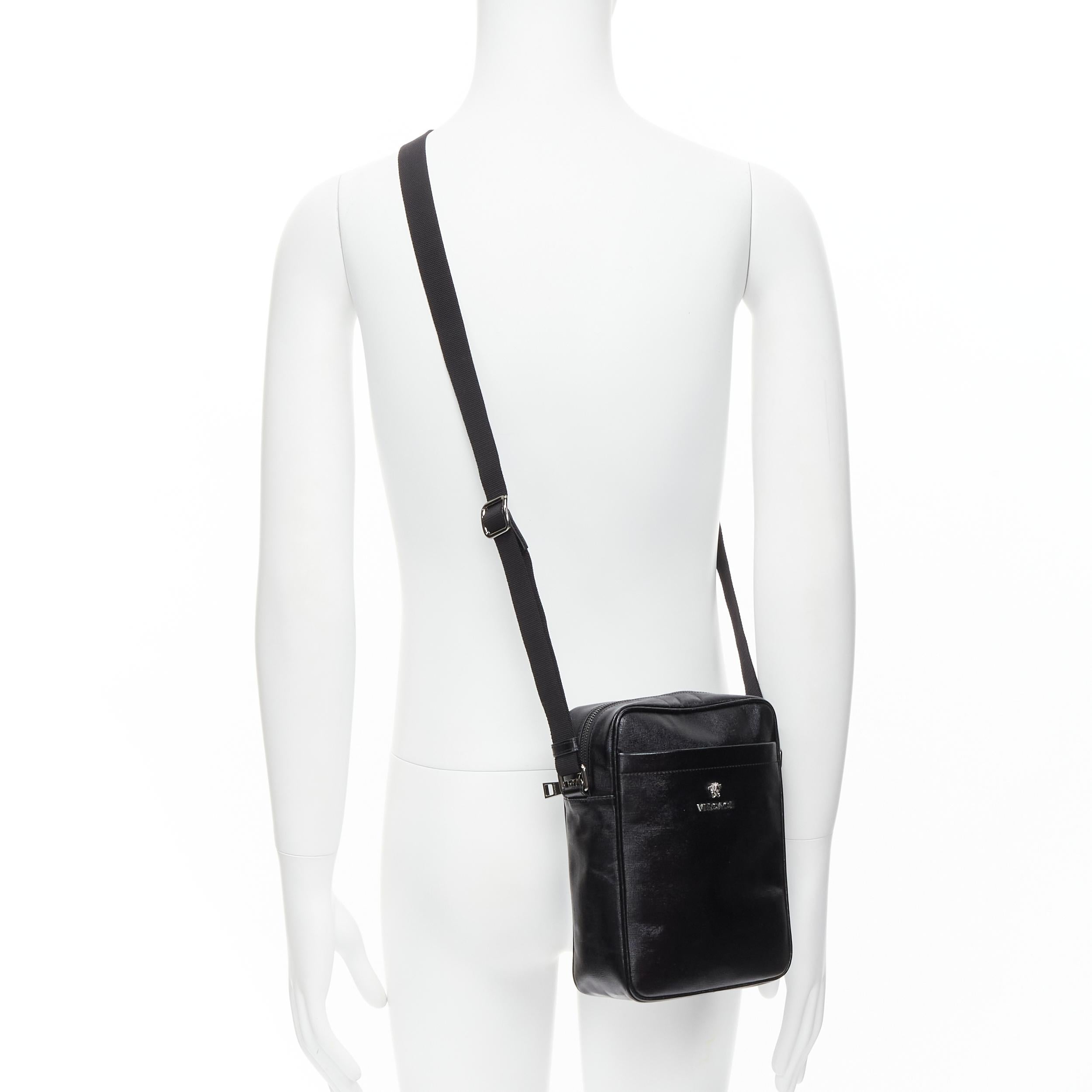 new VERSACE black lacquered saffiano leather silver Medusa crossbody bag 
Reference: TGAS/C00187 
Brand: Versace 
Designer: Donatella Versace 
Model: DL28125S DVIT2S D41E 
Material: Leather 
Color: Black 
Pattern: Solid 
Closure: Zip 
Extra Detail: