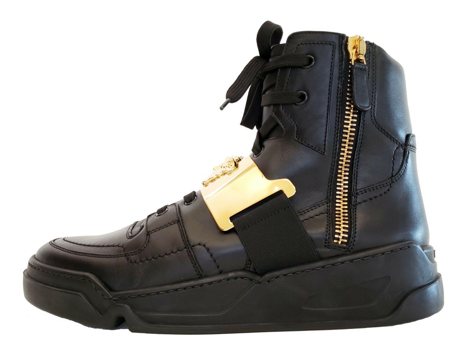 BRAND NEW 

VERSACE 

Black leather high-top sneakers.

This shoe is embodied in true Versace-style and
features smooth leather and gold tone details including
Versace’s signature Medusa head. It wouldn’t  be Versace without it.

Made in