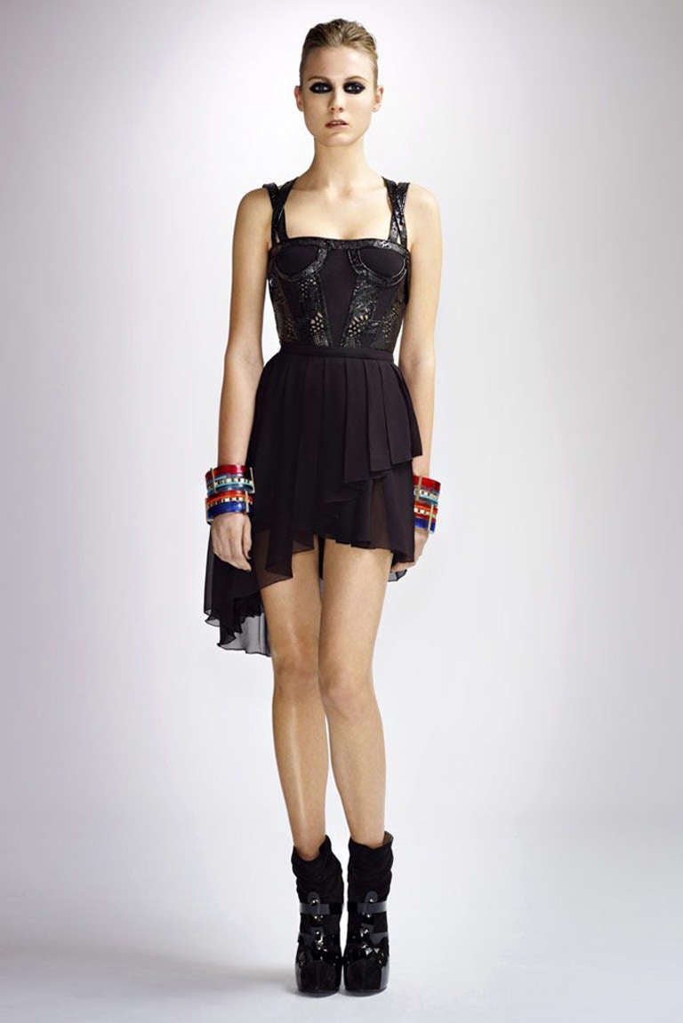 VERSACE

Create a scene at cocktail hour in Versace’s black silk-chiffon underwired mini dress with laser-cut patent-leather detail. 

This black silk-chiffon pleated mini dress with patent-leather detail has two cross-over straps with tulle and