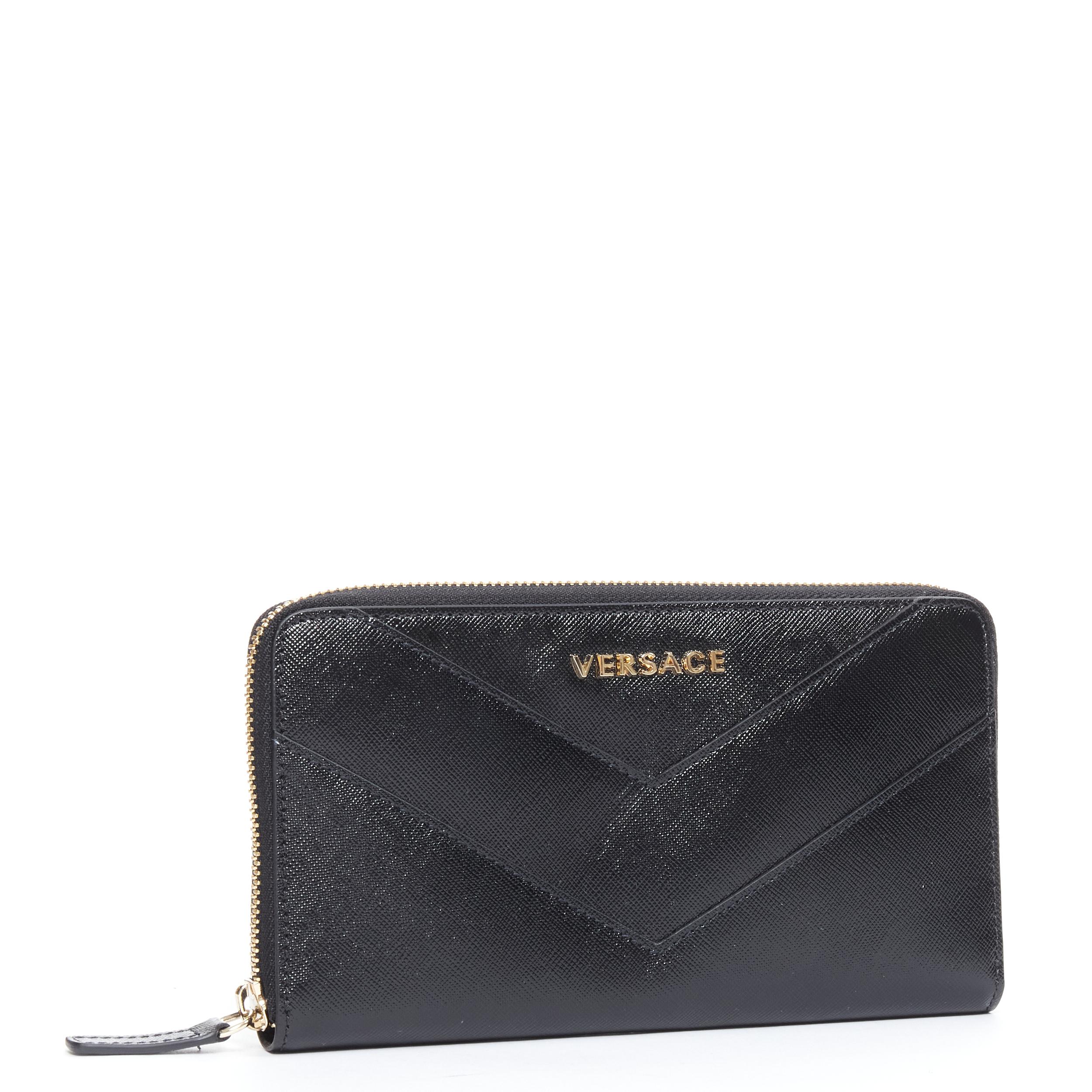 new VERSACE black saffiano leather gold logo V stitch continental long wallet 
Reference: TGAS/B01476 
Brand: Versace 
Designer: Donatella Versace 
Material: Leather 
Color: Black 
Pattern: Solid 
Closure: Zip 
Extra Detail: Black saffiano leather.