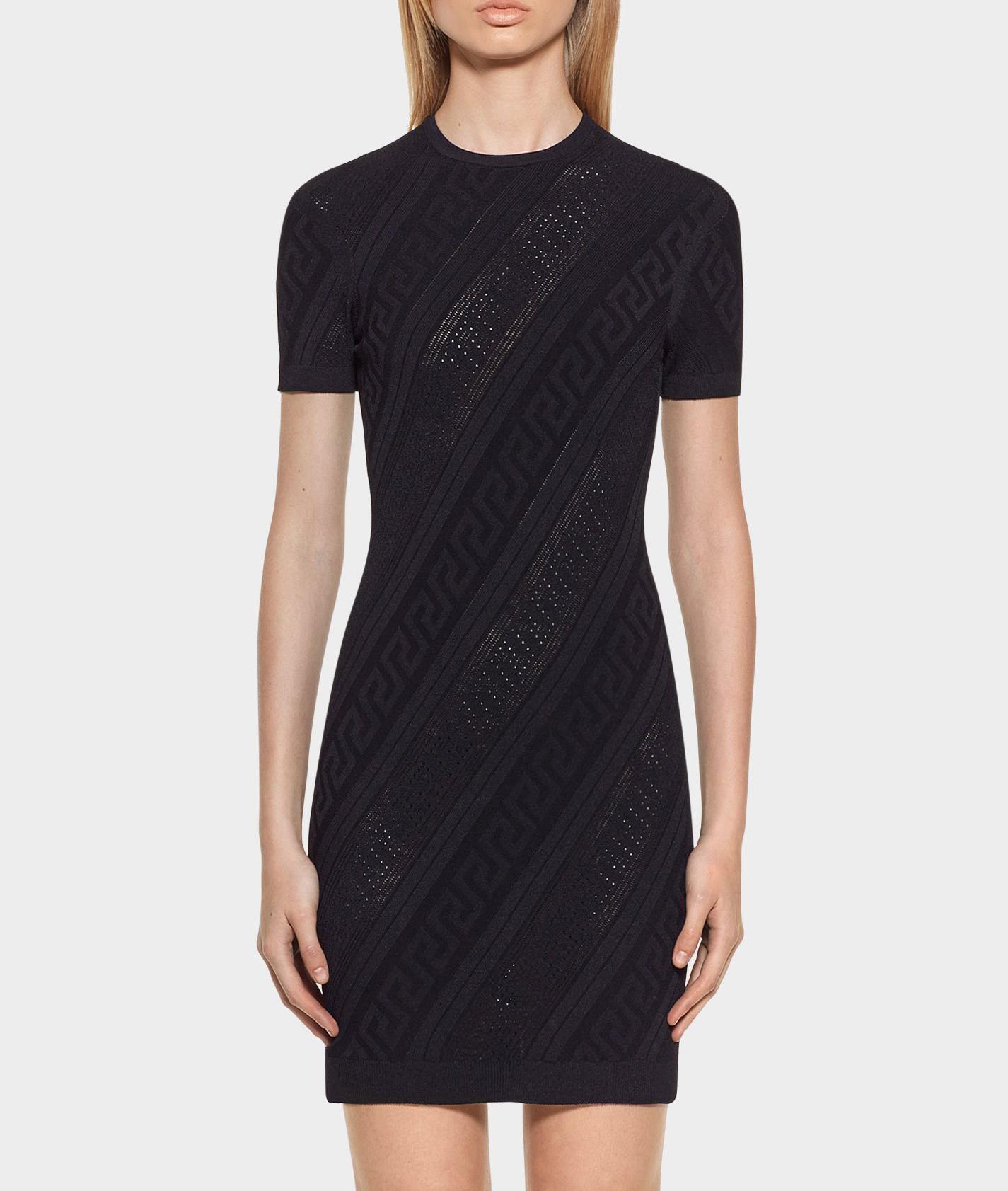 VERSACE 

This multi-stitched stretch short sleeve tight fitting knit dress is both versatile and stylish.

Multi-stitch
Greek Key detail
Round neck
Short sleeves
83% Viscose
17% Polyester

IT Size 44 - US 8
and
IT Size 42 - US 6

Made in