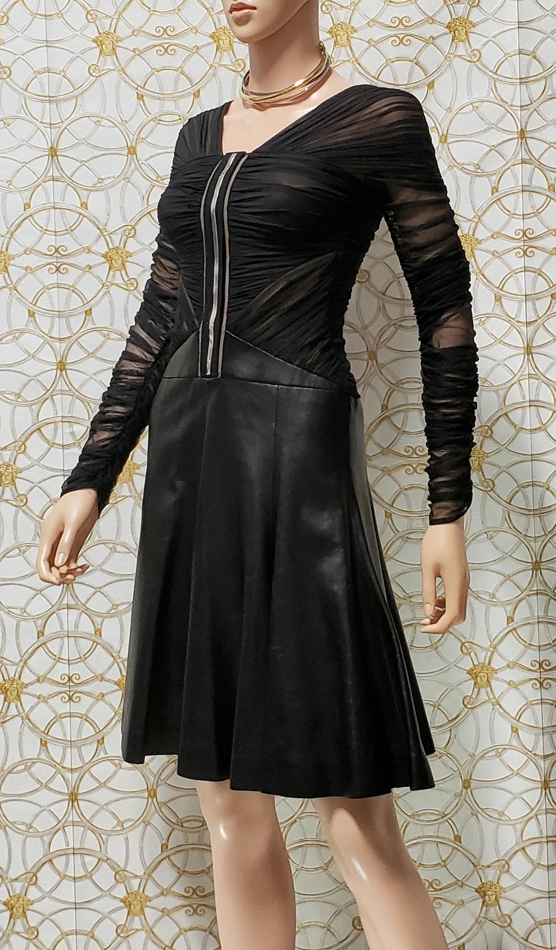 VERSACE


This dress has a tulle bodysuit and leather skirt

back zip 

Silver-tone Medusa hardware

Long sleeve


Content: 94% nylon, 6% elastane

lining: 96% rayon, 4% elastane 

lining 2: 100% silk

trim 1: 100% nylon

trim 2: 82% nylon, 18%