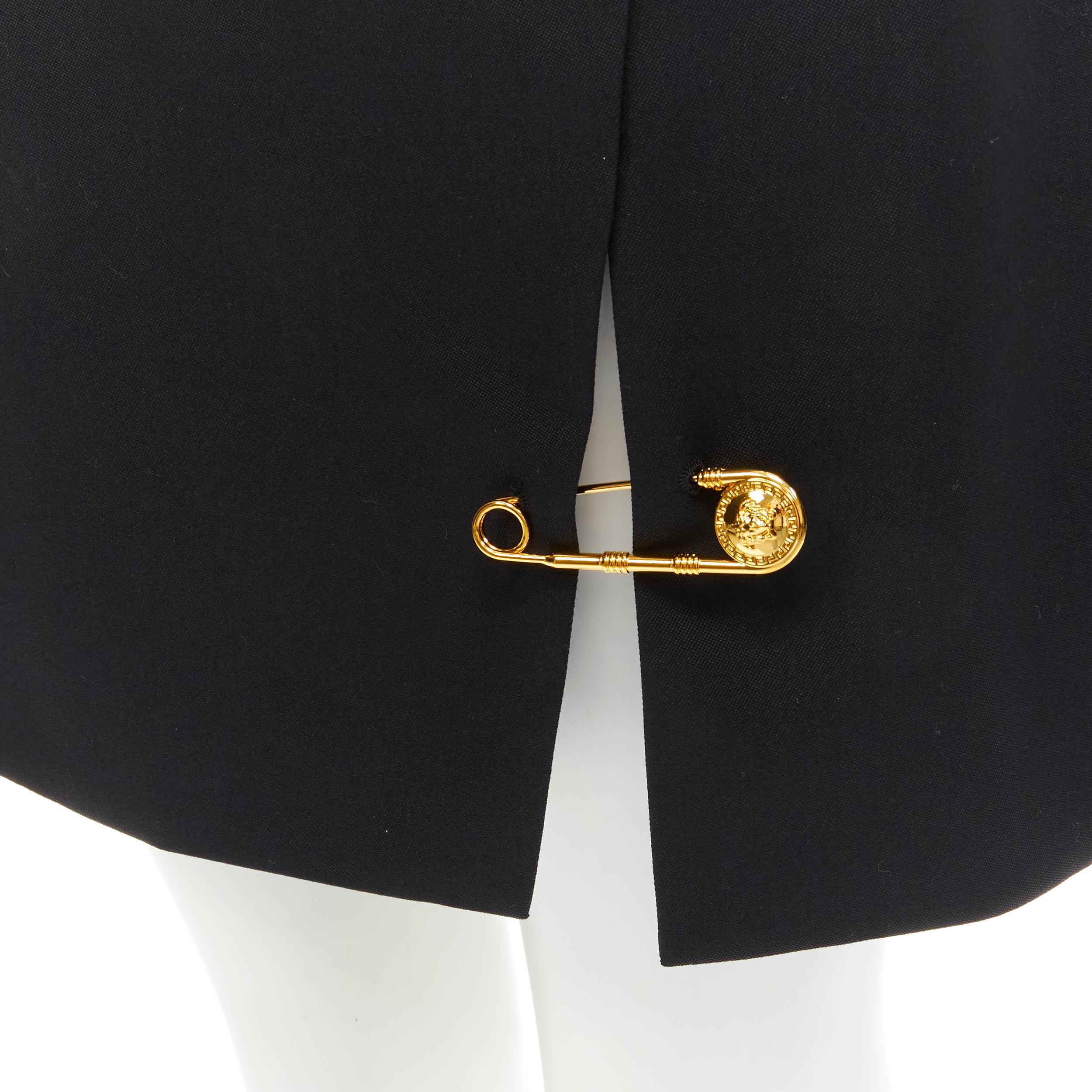 new VERSACE black wool gold Medusa safety pin high slit mini skirt IT42 M 
Reference: TGAS/C00799
Brand: Versace 
Designer: Donatella Versace 
Material: Wool 
Color: Black 
Pattern: Solid 
Closure: Zip 
Extra Detail: Detachable gold-tone Medusa