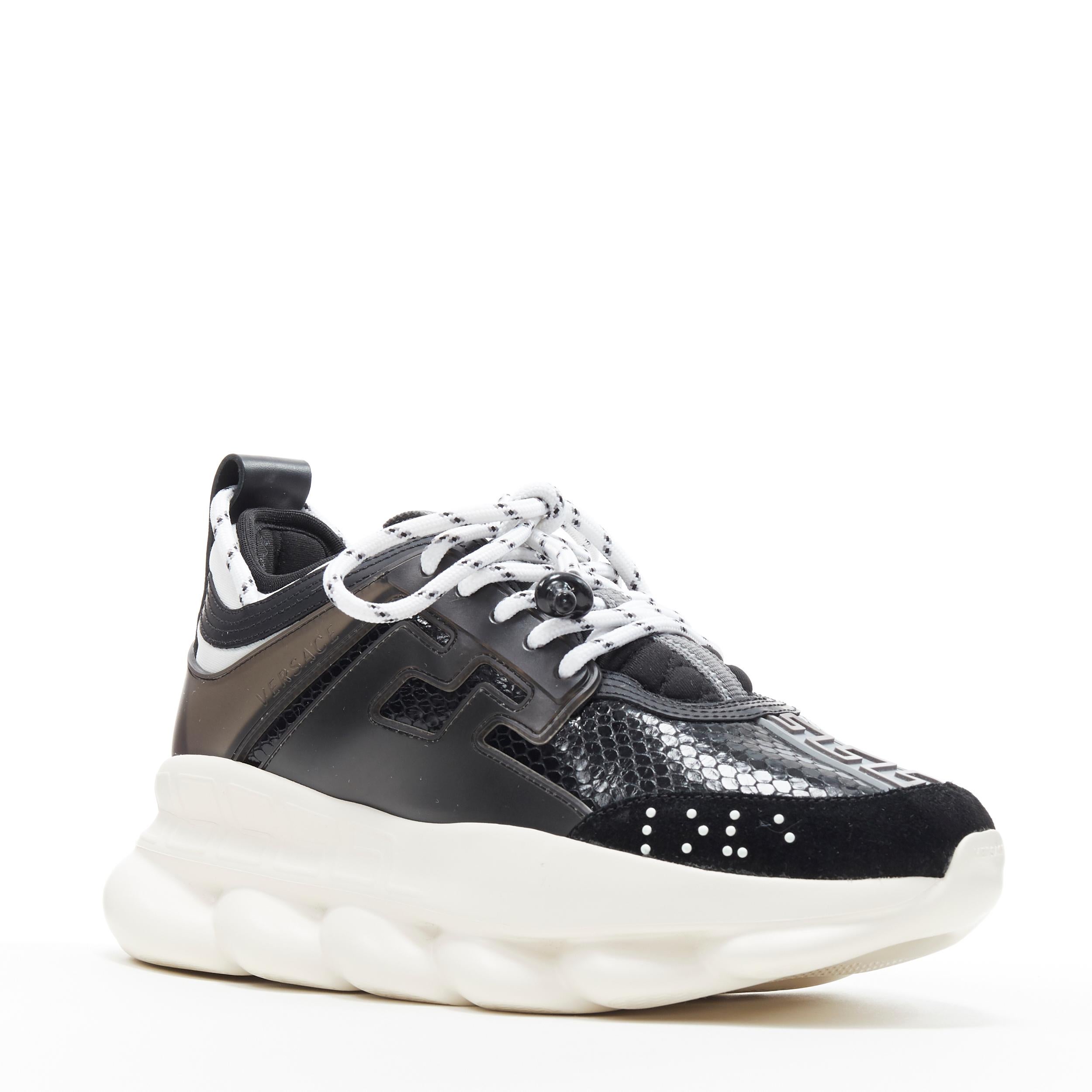 new VERSACE Chain Reaction Black glossy snake low chunky dad sneaker EU39 US9 Reference: TGAS/A06330 
Brand: Versace 
Designer: Salehe Bembury 
Model: Chain Reaction Black Python 
Material: Leather 
Color: Black 
Pattern: Snakeskin 
Closure: Lace up