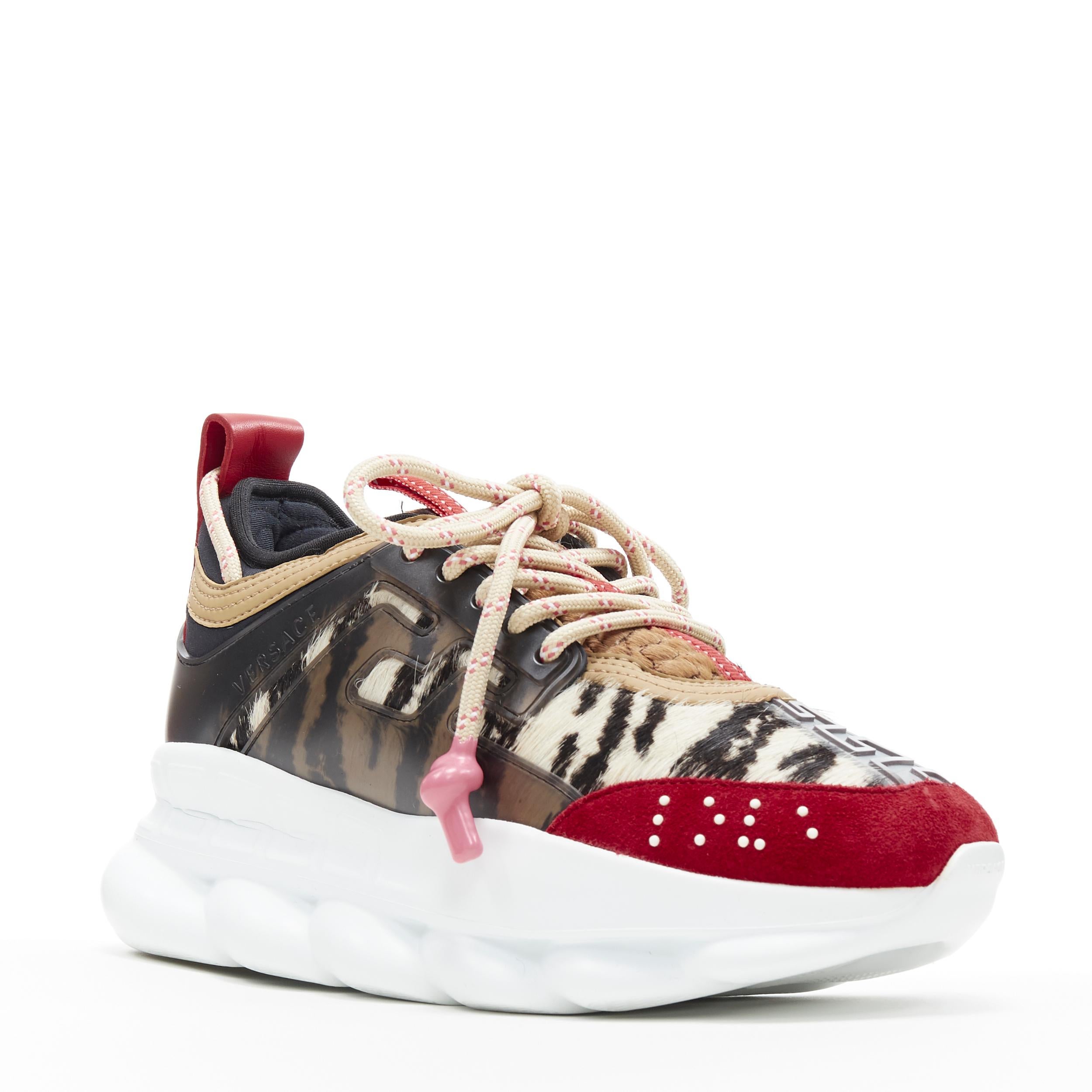 new VERSACE Chain Reaction Wild Red Animal calf hair low dad sneaker EU38 US8 Reference: TGAS/B00194 
Brand: Versace 
Designer: Salehe Bembury 
Model: Chain Reaction Wild Leopard 
Material: Leather 
Color: Red 
Pattern: Zebra 
Closure: Lace up
