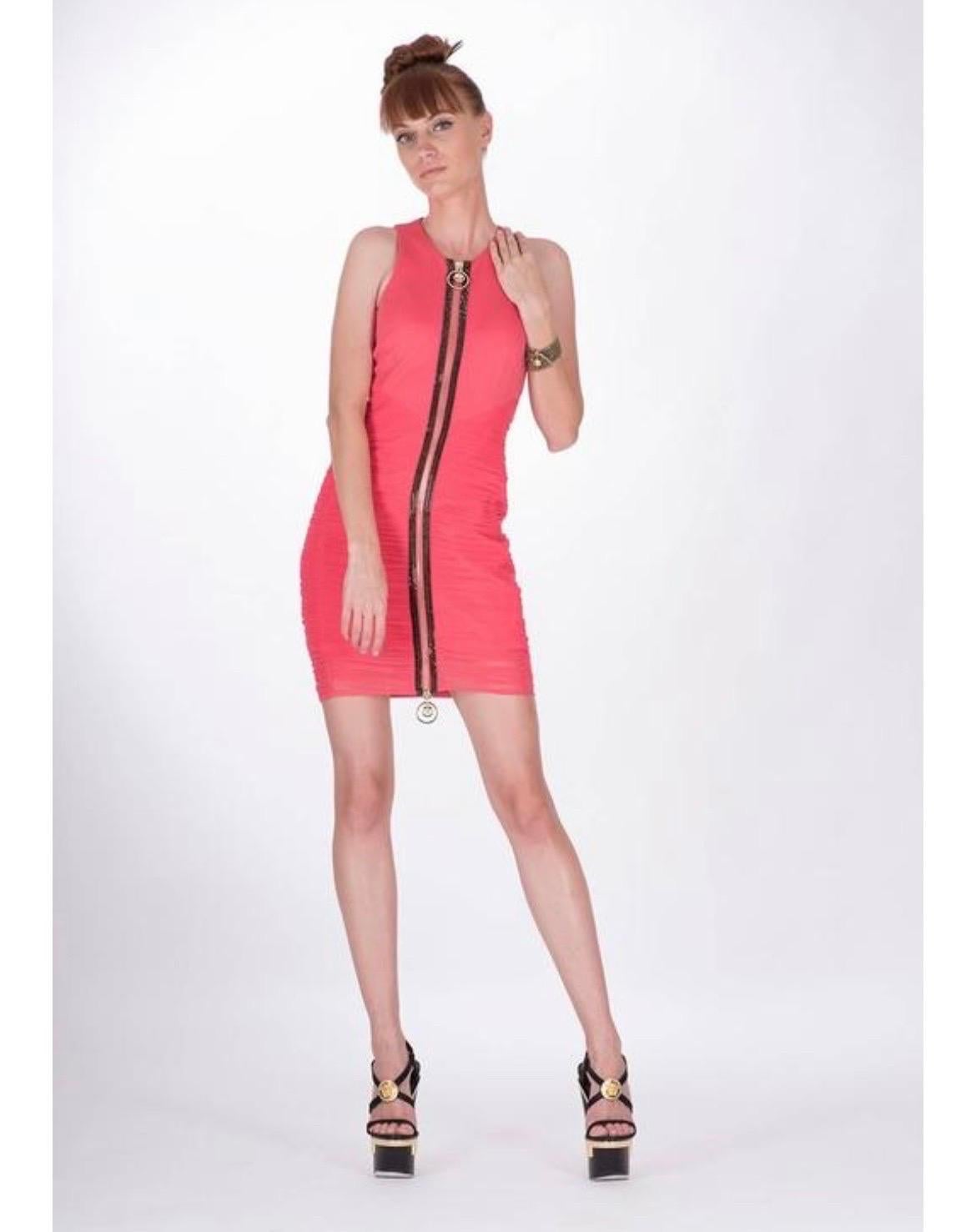 Versace  
Crystal Embellished ruched mini dress. Exposed zip fastening finished with crystals and Medusa zipper pull  67% viscose, 26% nylon, 7% elastane  Fully lined. Made in Italy  
IT Sizes: 38, 40 and 42  
The fabric has a lot of stretch. 