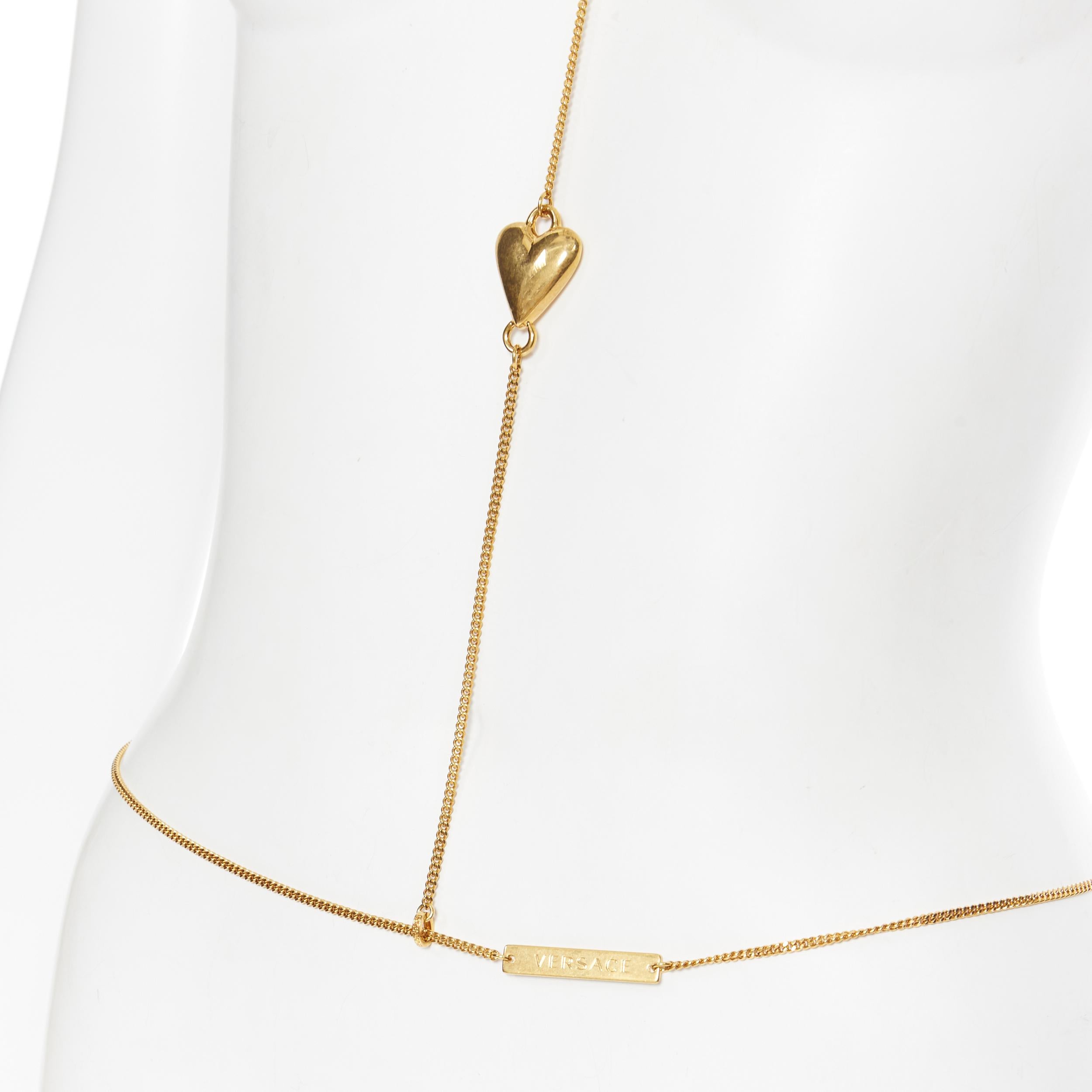 new VERSACE DV Virtus Love Heart logo plate Medusa gold-tone bodychain necklace 
Brand: Versace
Designer: Donatella Versace
Collection: Fall Winter 2019
Model Name / Style: Body chain
Material: Nickel
Color: Gold
Pattern: Solid
Extra Detail: