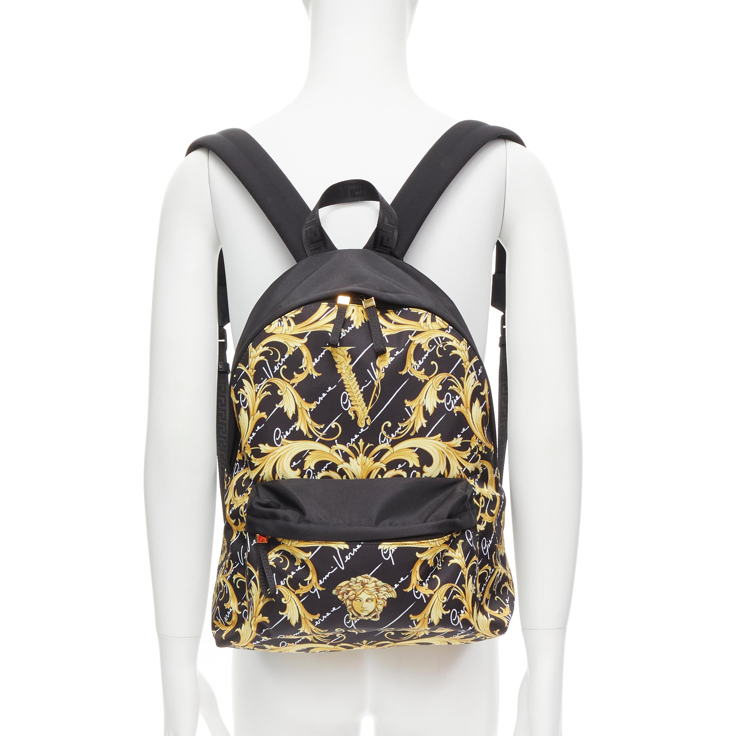 new VERSACE Gianni Signature gold Barocco Virtus Medusa print backpack bag 
Reference: TGAS/C00705 
Brand: Versace 
Designer: Donatella Versace 
Model: 1002886 1A02182 5800V 
Material: Nylon 
Color: Black 
Pattern: Floral 
Closure: Zip 
Extra