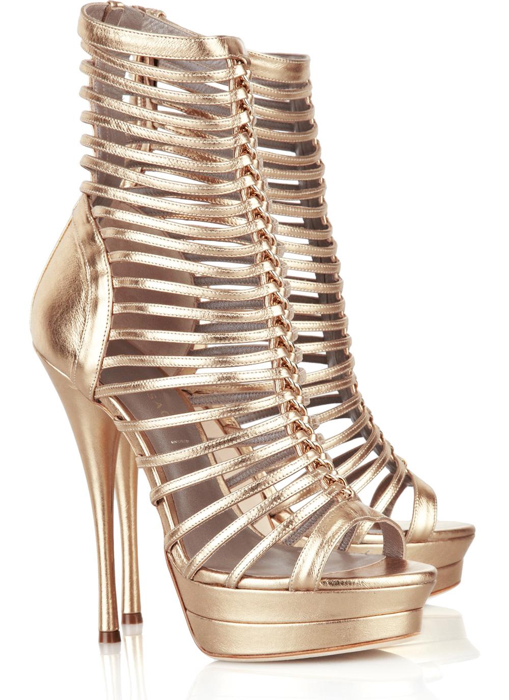 Bring high-octane glamour to the party with Versace's gold leather gladiator sandals.
Designer size 38.5 - US 8.5
Gold leather gladiator sandals with a heel that measures 5 3/4 inches and approx. 1 1/4 inches platform. Versace sandals have an almond