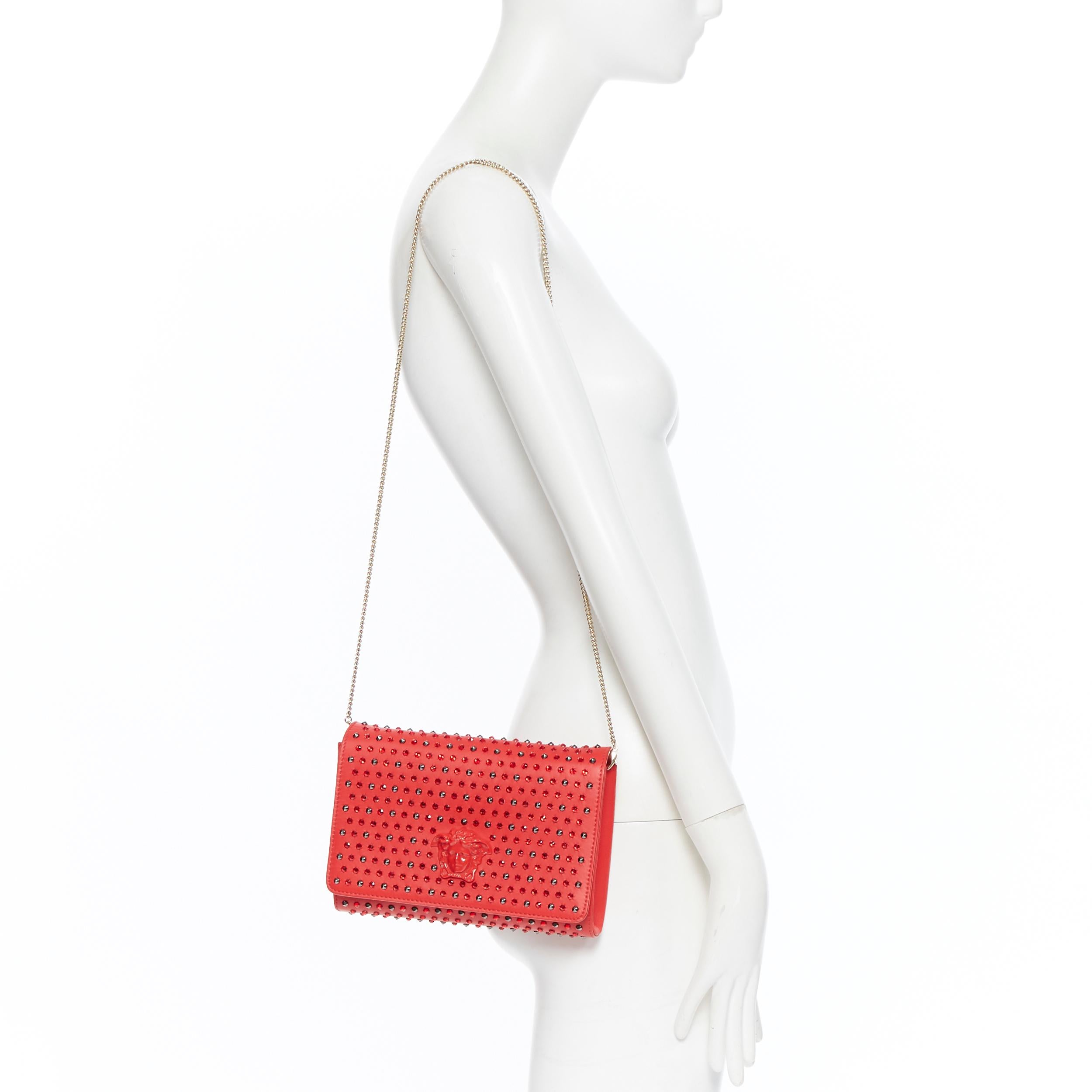 new VERSACE gold leather tonal Medusa head crystal strass stud flap clutch bag 
Brand: Versace
Designer: Donatella Versace
Model Name / Style: Flap clutch
Material: Leather
Color: Red
Pattern: Solid
Closure: Magnetic
Lining material: Canvas
Extra
