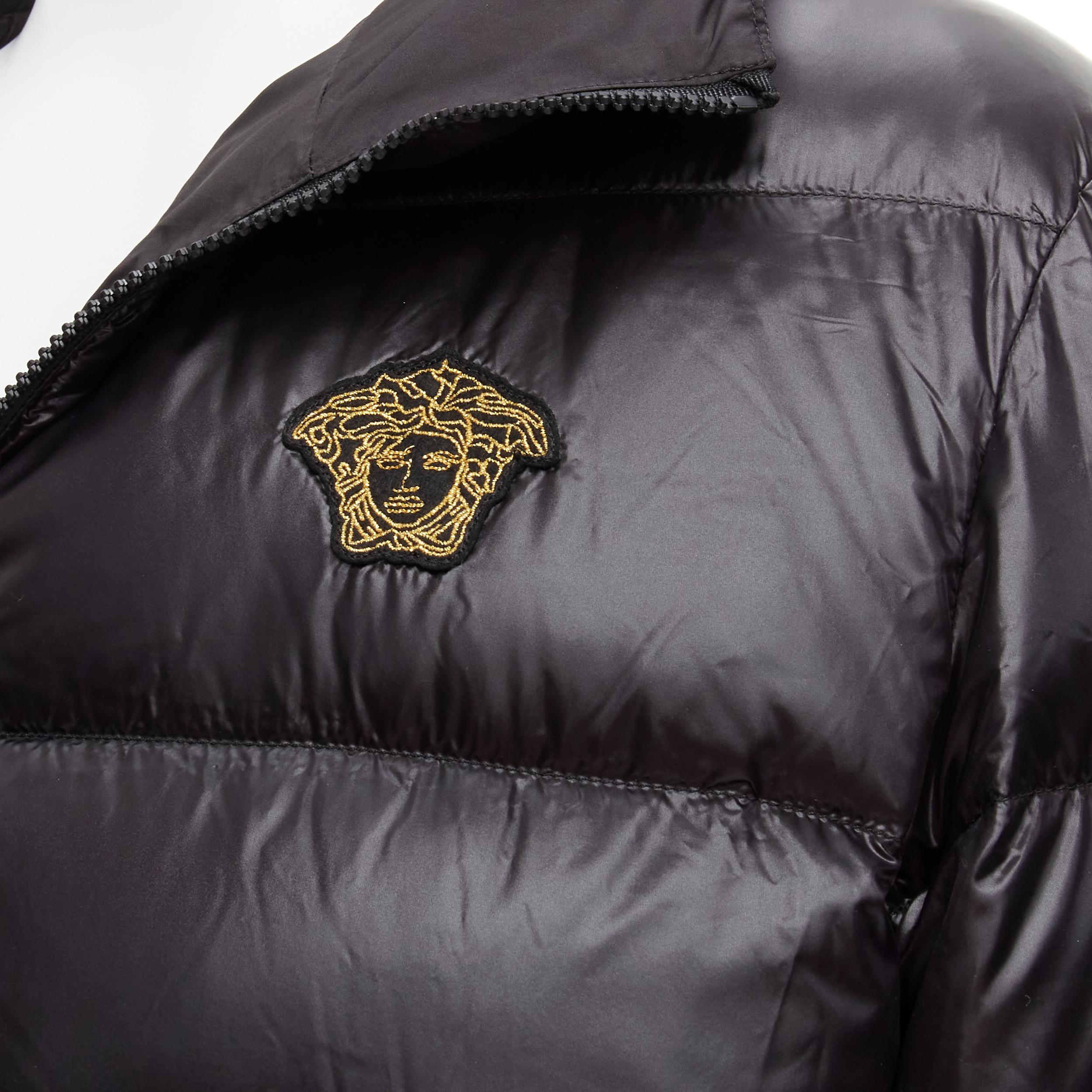 new VERSACE gold Medusa badge black goose down duvet puffer jacket IT50 L 
Reference: TGAS/C00616 
Brand: Versace 
Designer: Donatella Versace 
Material: Goose Down 
Color: Black 
Pattern: Solid
Extra Detail: Black nylon with 80% goose down and 20%
