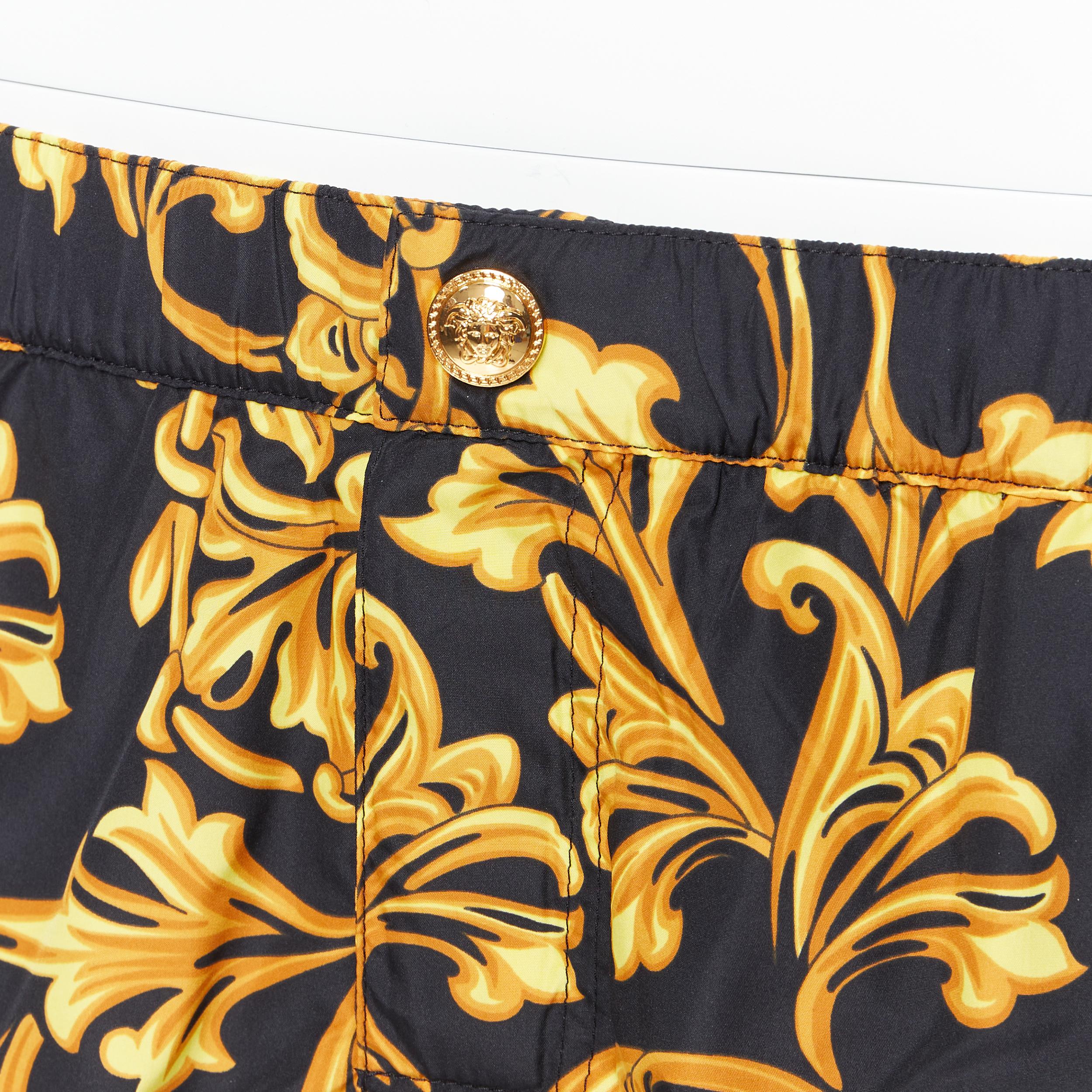 new VERSACE gold Medusa button black floral barocco summer swim shorts IT6 L 
Reference: TGAS/B00603 
Brand: Versace 
Designer: Donatella Versace 
Material: Polyester 
Color: Black 
Pattern: Floral 
Extra Detail: Gold-tone Medusa button. Dual side