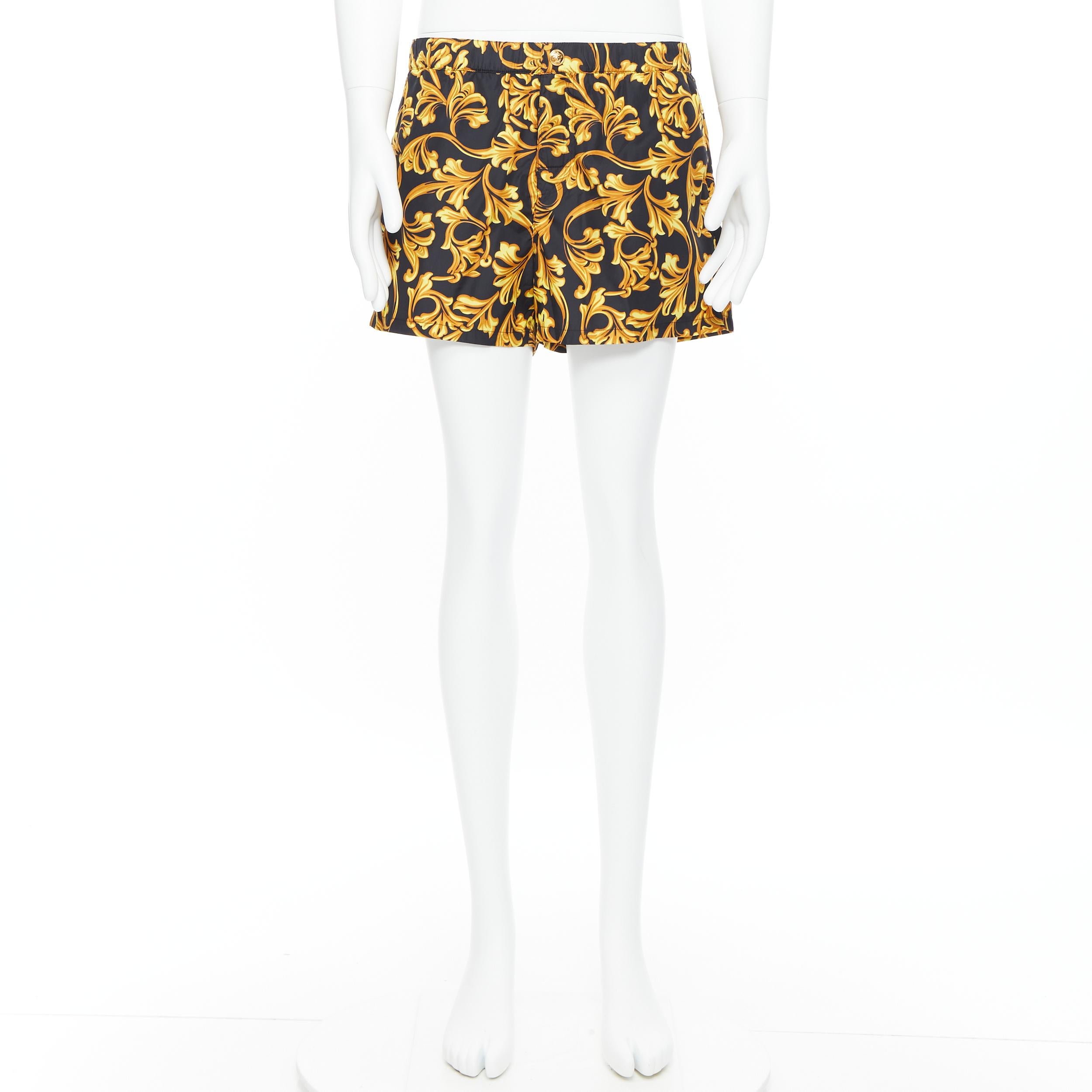 black and gold swim shorts