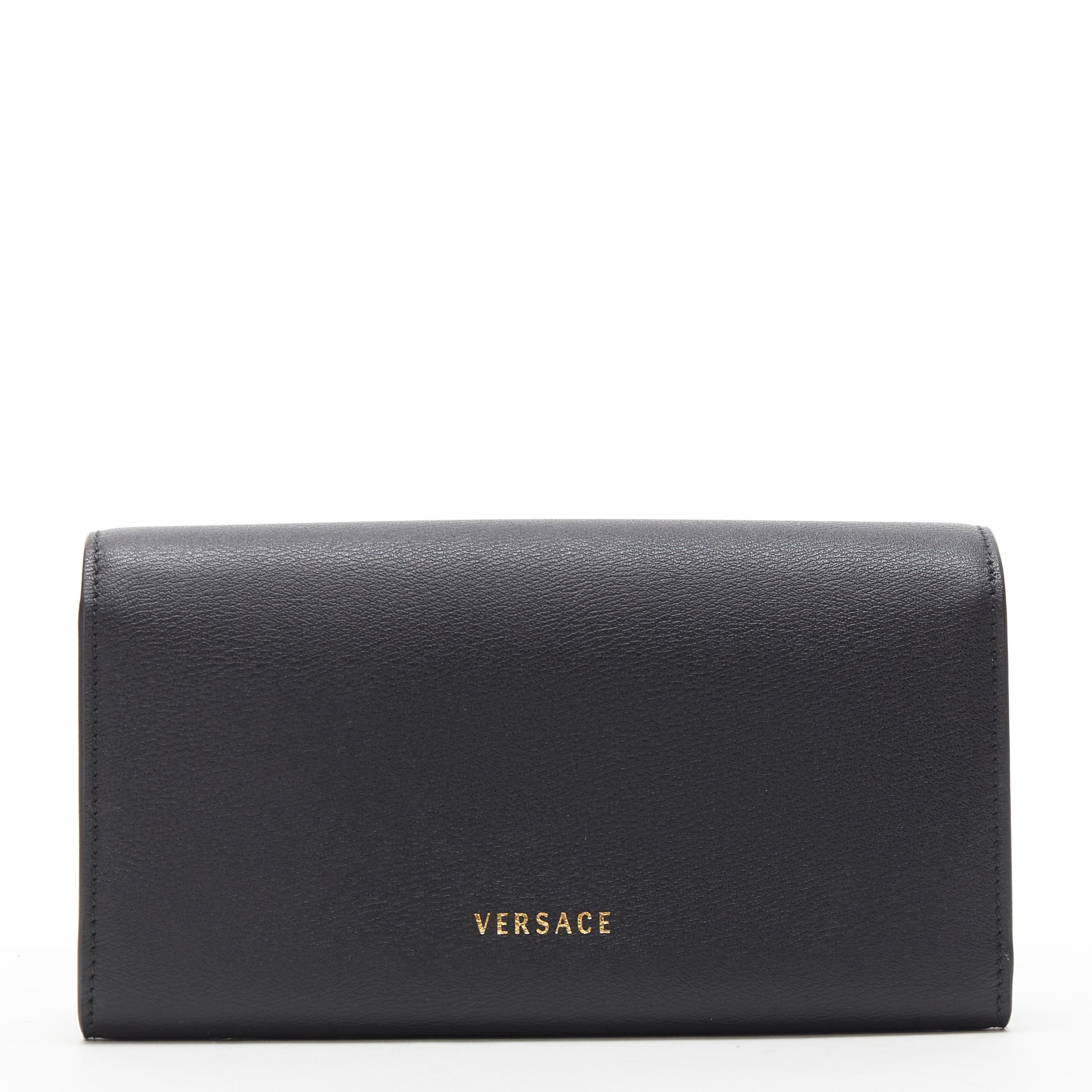 new VERSACE gold medusa coin calf leather flap long continental wallet 
Reference: TGAS/B00676 
Brand: Versace 
Designer: Donatella Versace 
Material: Leather 
Color: Black 
Pattern: Solid 
Closure: Button 
Made in: Italy 

CONDITION: 
Condition: