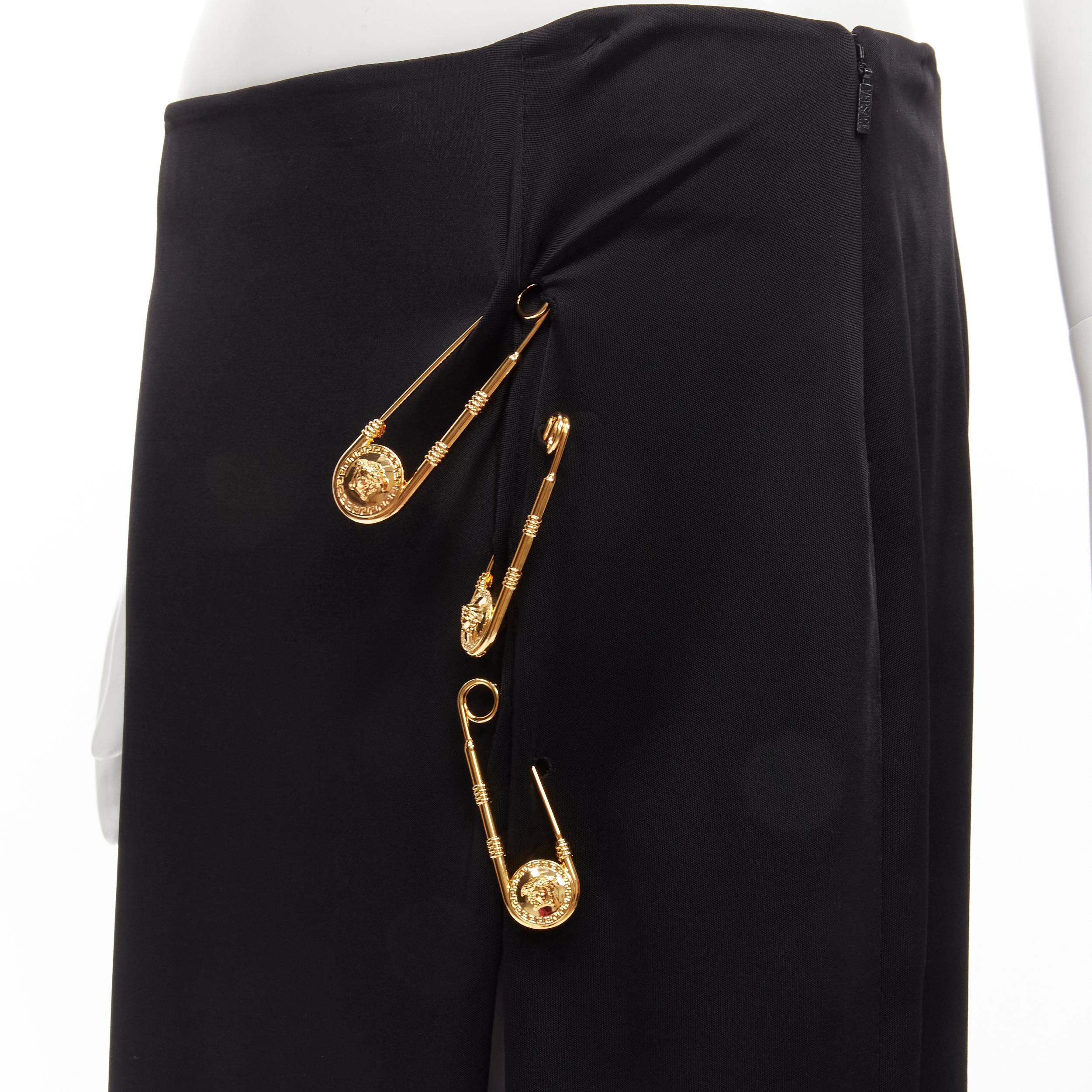 new VERSACE gold Medusa safety pin black viscose high slit skirt IT44 L 
Reference: TGAS/C00999 
Brand: Versace 
Designer: Donatella Versace 
Material: Viscose 
Color: Black 
Pattern: Solid 
Closure: Zip 
Extra Detail: Medusa head safety pin are
