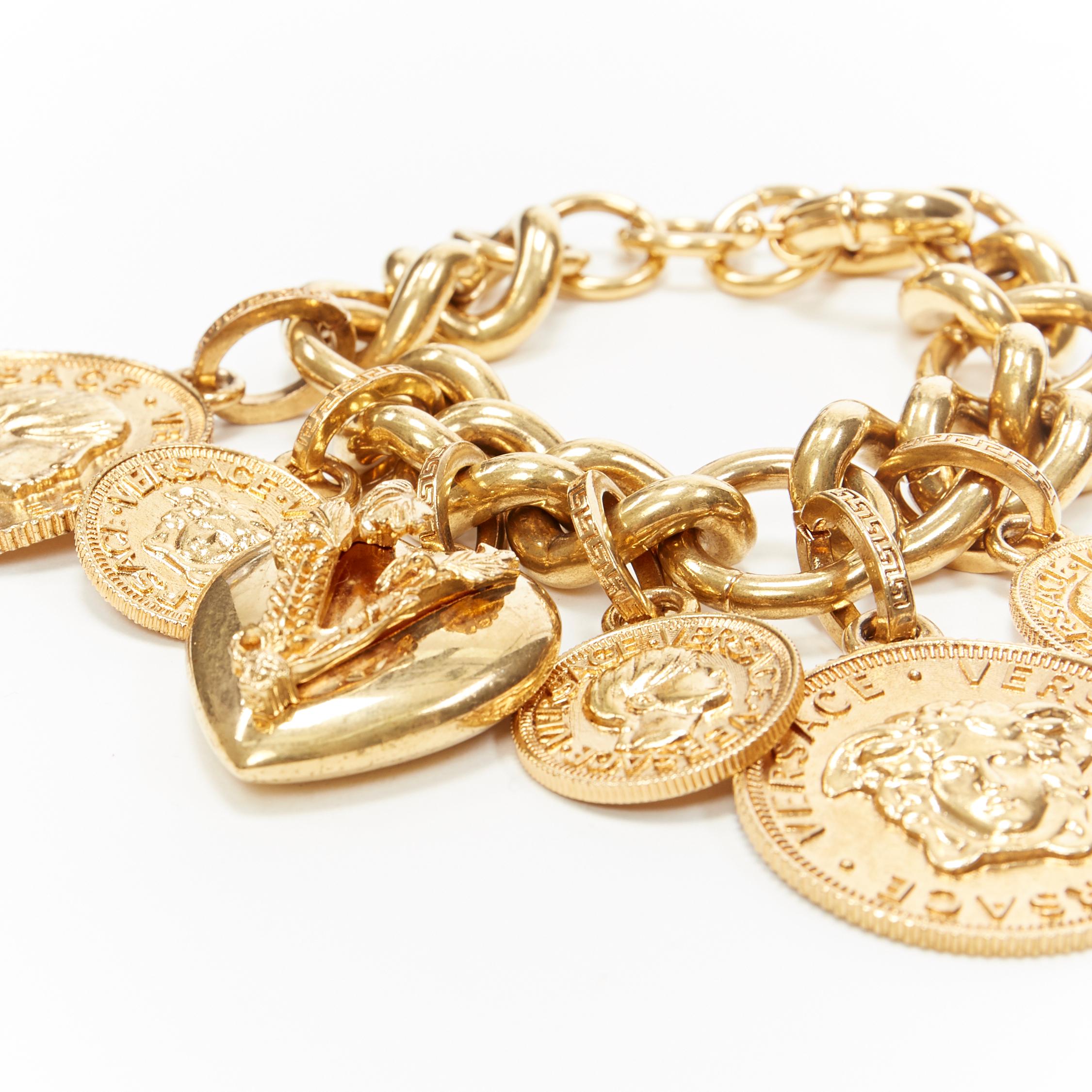 new VERSACE gold plated V-Mine Heart Medusa medallion coin charm chunky bracelet
Brand: Versace
Designer: Donatella Versace
Collection: 2019
Model Name / Style: Chunky bracelet
Material: Metal
Color: Gold
Pattern: Solid
Closure: Clasp
Extra Detail:
