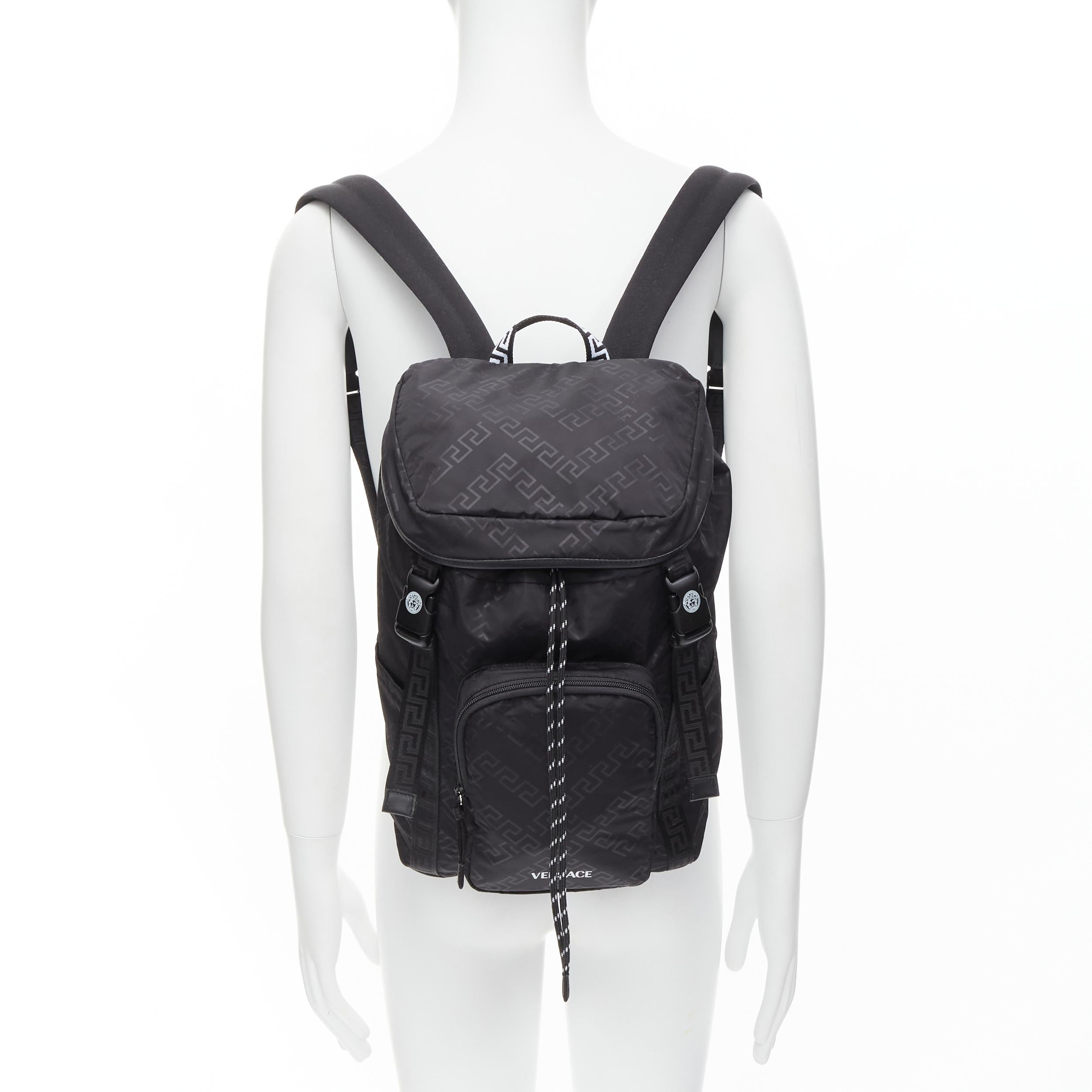 new VERSACE Greca black nylon white Medusa buckle Technical backpack 
Reference: TGAS/C00020 
Brand: Versace 
Designer: Donatella Versace 
Model: DFZ8582S DNYJS D41P 
Material: Nylon 
Color: Black 
Pattern: Abstract 
Closure: Drawstring 
Extra