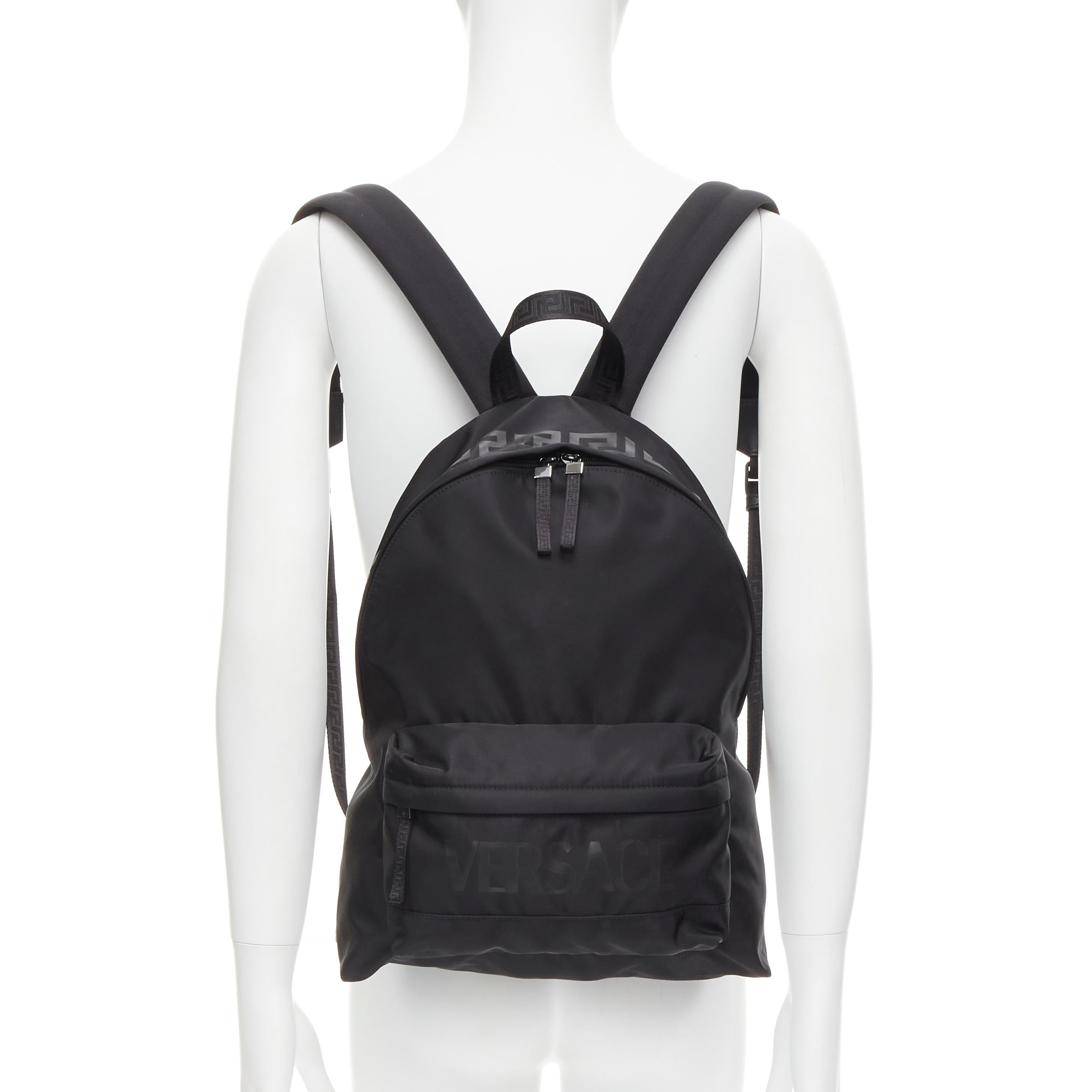 new VERSACE La Greca 90's logo black nylon backpack bag 
Reference: TGAS/C00345 
Brand: Versace 
Designer: Donatella Versace 
Model: 1002886 1A02180 2B77E Collection: La Greca 
Material: Nylon 
Color: Black 
Pattern: Solid 
Closure: Zip 
Extra