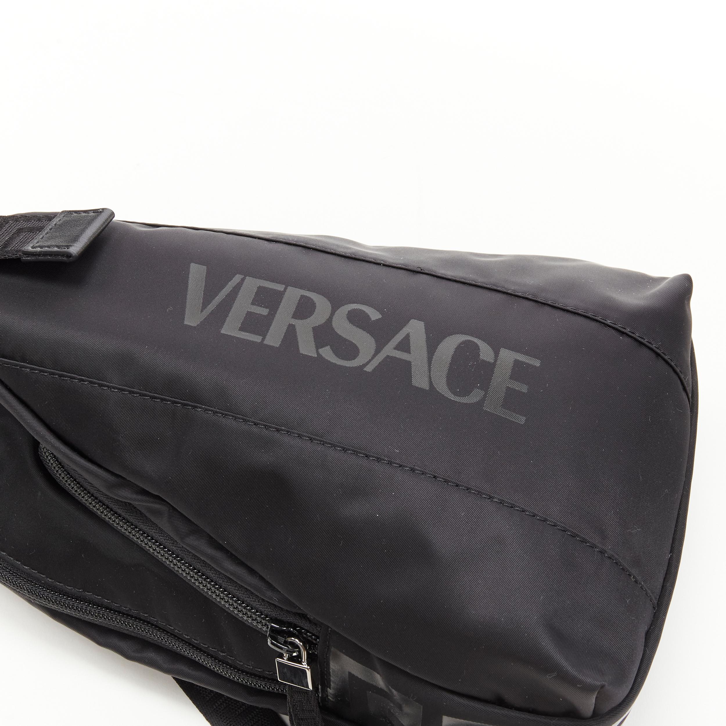 new VERSACE La Greca Vintage 90s Logo black nylon small sling backpack bag In New Condition In Hong Kong, NT