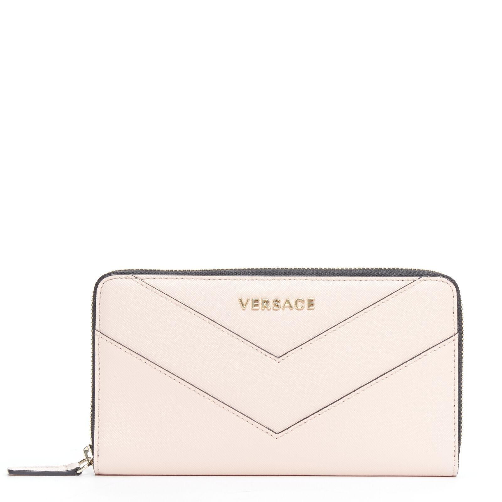 new VERSACE light pink saffiano leather gold logo V stitch continental wallet 
Reference: TGAS/B01207 
Brand: Versace 
Designer: Donatella Versace 
Material: Leather 
Color: Pink 
Pattern: Solid 
Closure: Zip 
Extra Detail: Blush light pink saffiano