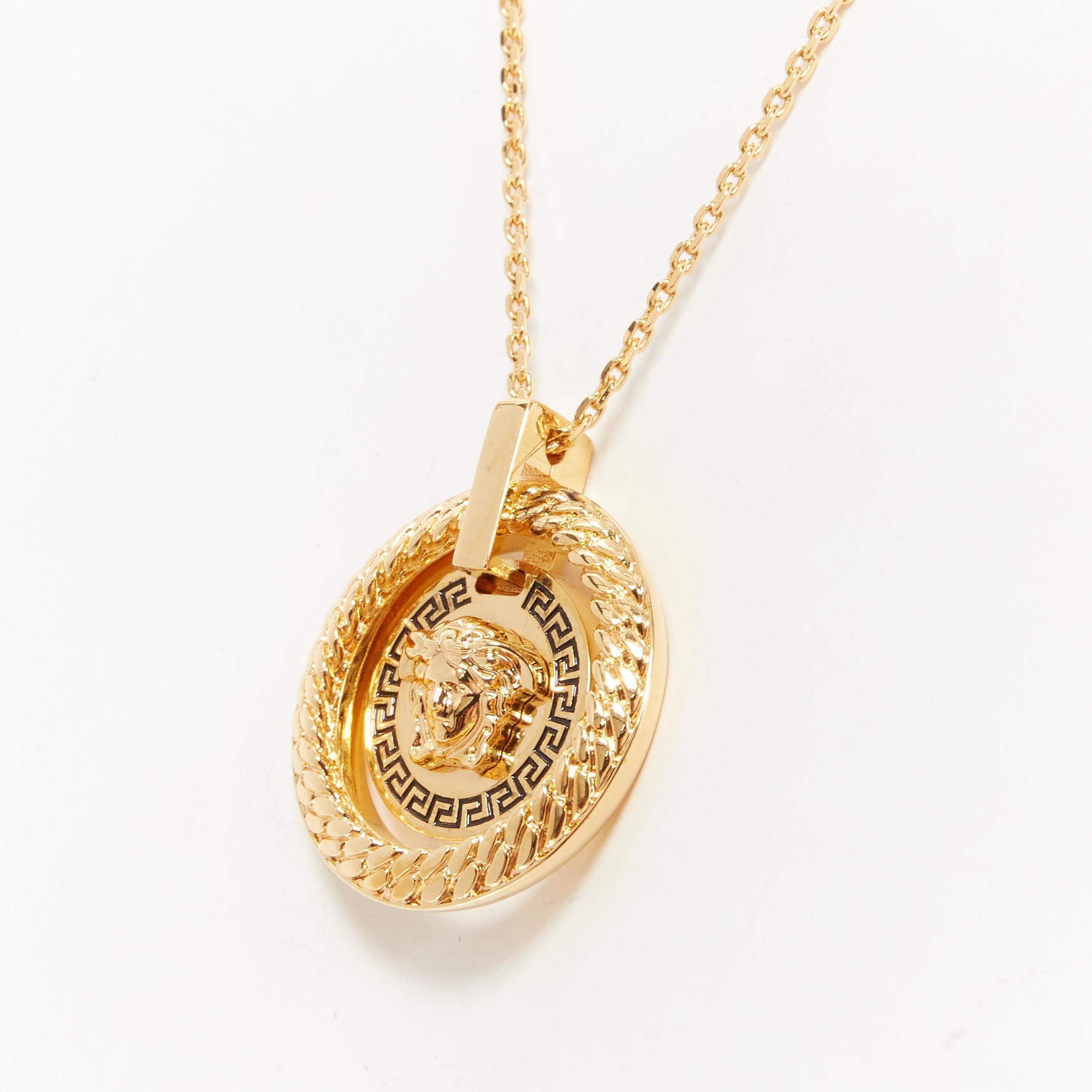 new VERSACE Medusa gold medallion coin Greca halo pendant short necklace 
Reference: TGAS/B01130 
Brand: Versace 
Designer: Donatella Versace 
Material: Nickel 
Color: Gold 
Pattern: Solid 
Closure: Clasp 
Extra Detail: 3D Medusa face coin medallion