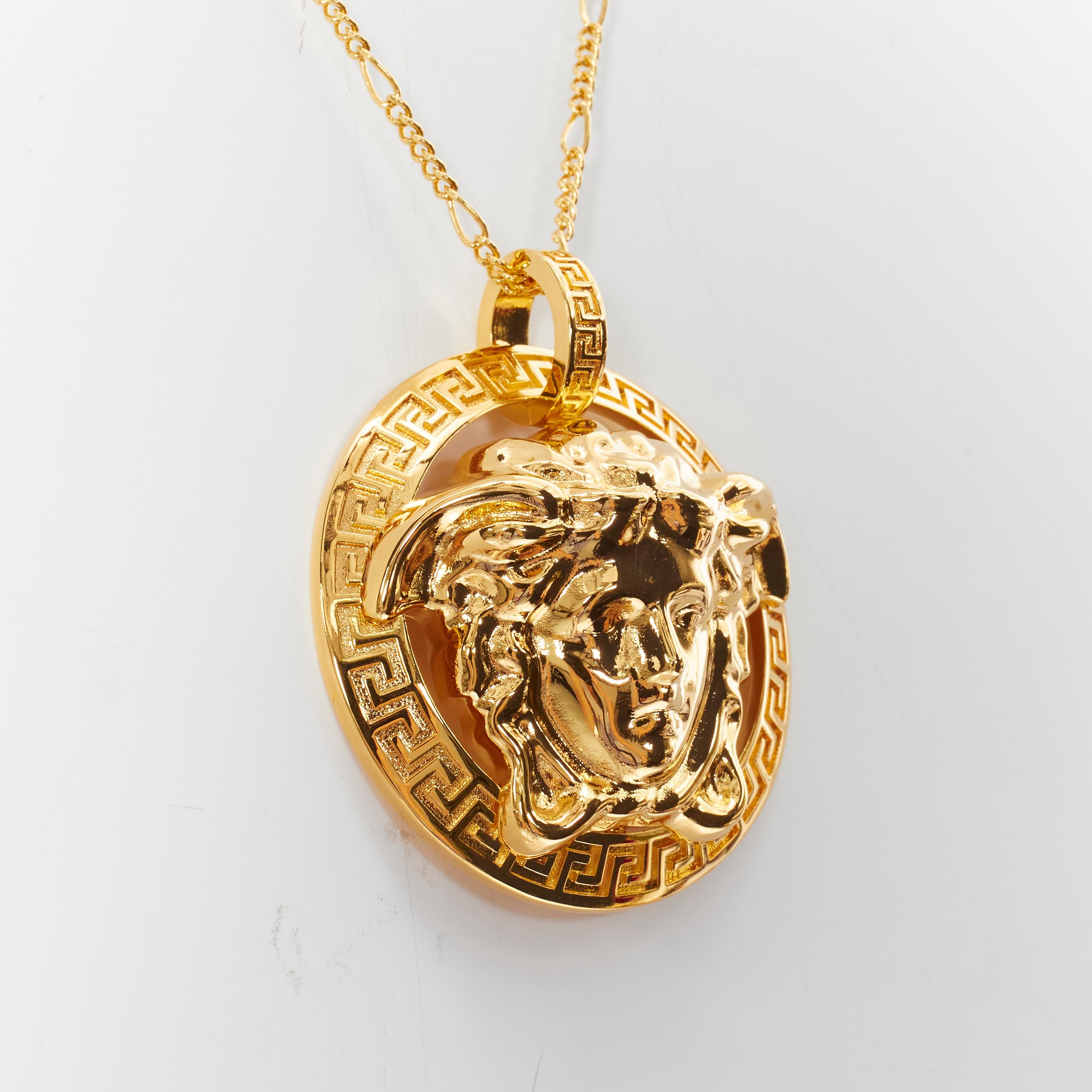 new VERSACE Medusa Greca XL coin medallion gold tone nickel short necklace 
Reference: TGAS/B01127 
Brand: Versace 
Designer: Donatella Versace 
Material: Nickel 
Color: Gold 
Pattern: Solid 
Closure: Clasp 
Extra Detail: Oversized 3D Medusa head