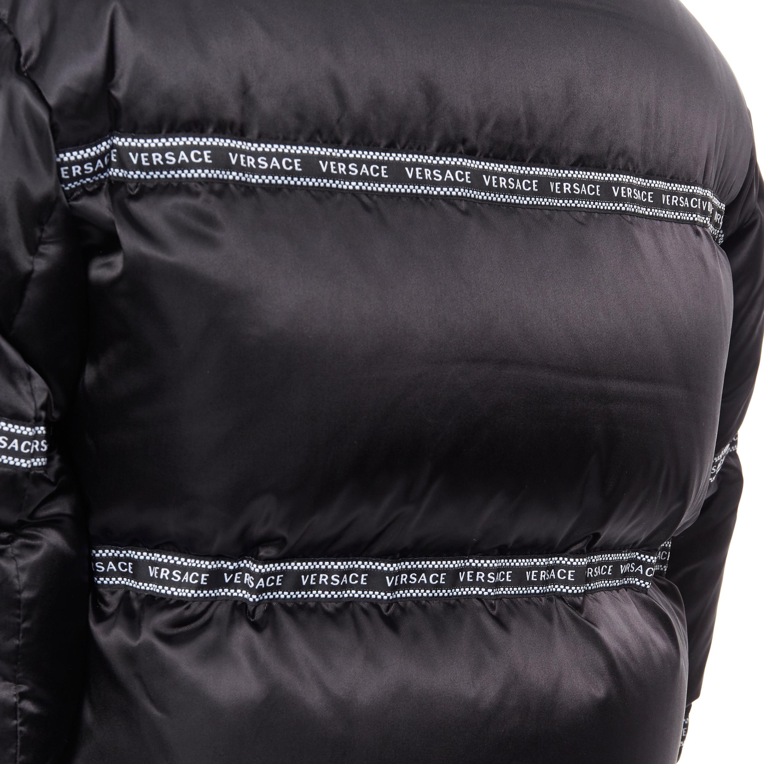 new VERSACE Nastro Stampa black logo ribbon goose down padded jacket IT48 M
Brand: Versace
Designer: Donatella Versace
Collection: 2019
Model Name / Style: Nastro Stampa down jacket
Material: Nylon
Color: Black
Pattern: Solid
Closure: Zip
Extra