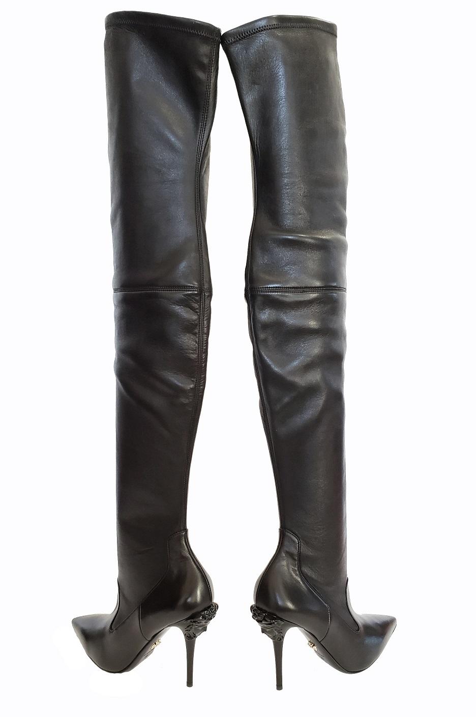 VERSACE 

Thigh High Boot With Medusa Heel

These stylish thigh boots exude style and confidence.

Stretch nappa leather upper

Shaft measures approx 25 inches in length

Approx 4 inch heel


Hidden side zip closure

Made in Italy

IT Size 39 - US