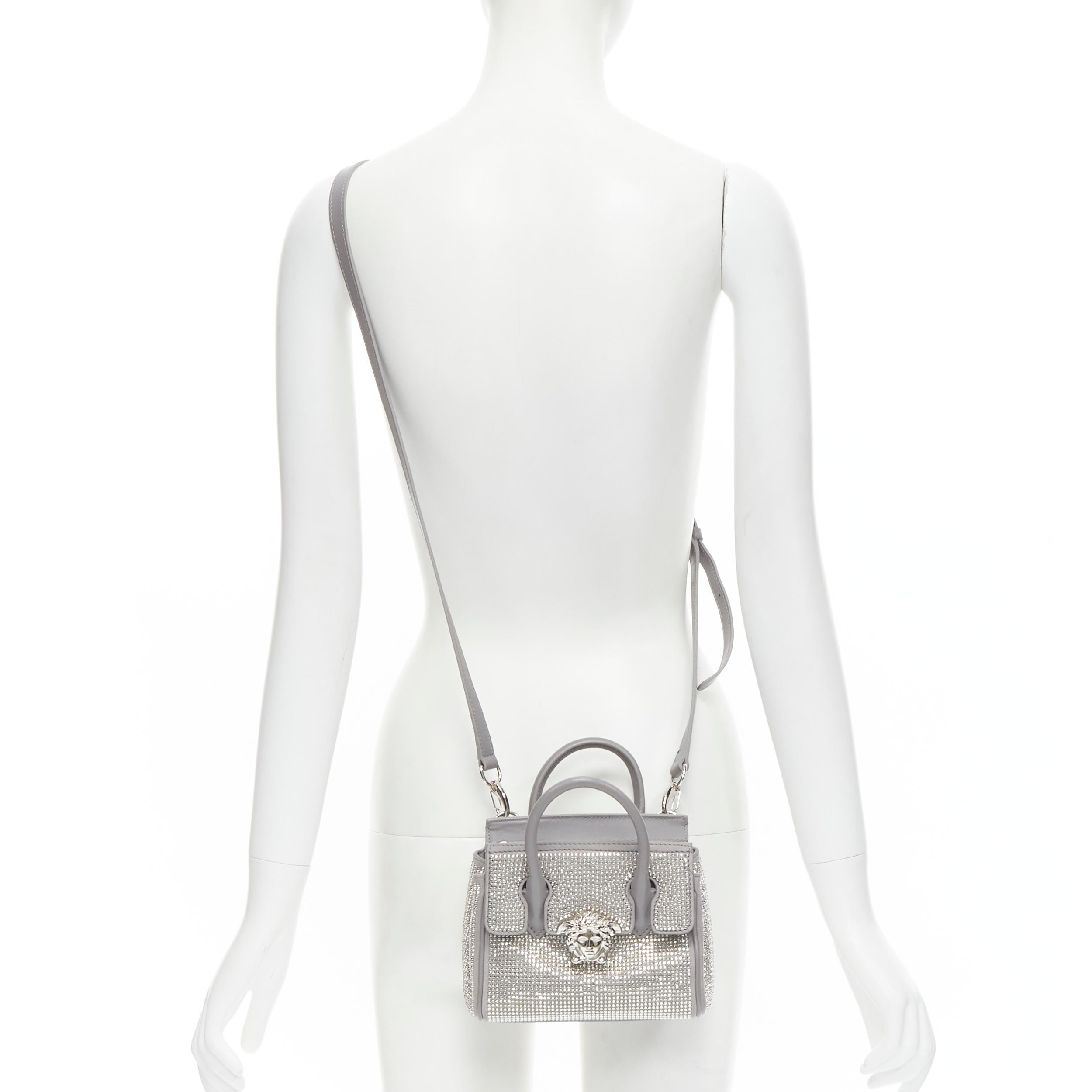 new VERSACE Palazzo Empire Mini Limited Edition grey crystal crossbody bag 
Reference: TGAS/B02062 
Brand: Versace 
Designer: Donatella Versace 
Model: Empire Mini 
Material: Leather 
Color: Grey 
Pattern: Solid 
Closure: Zip 
Extra Detail: This