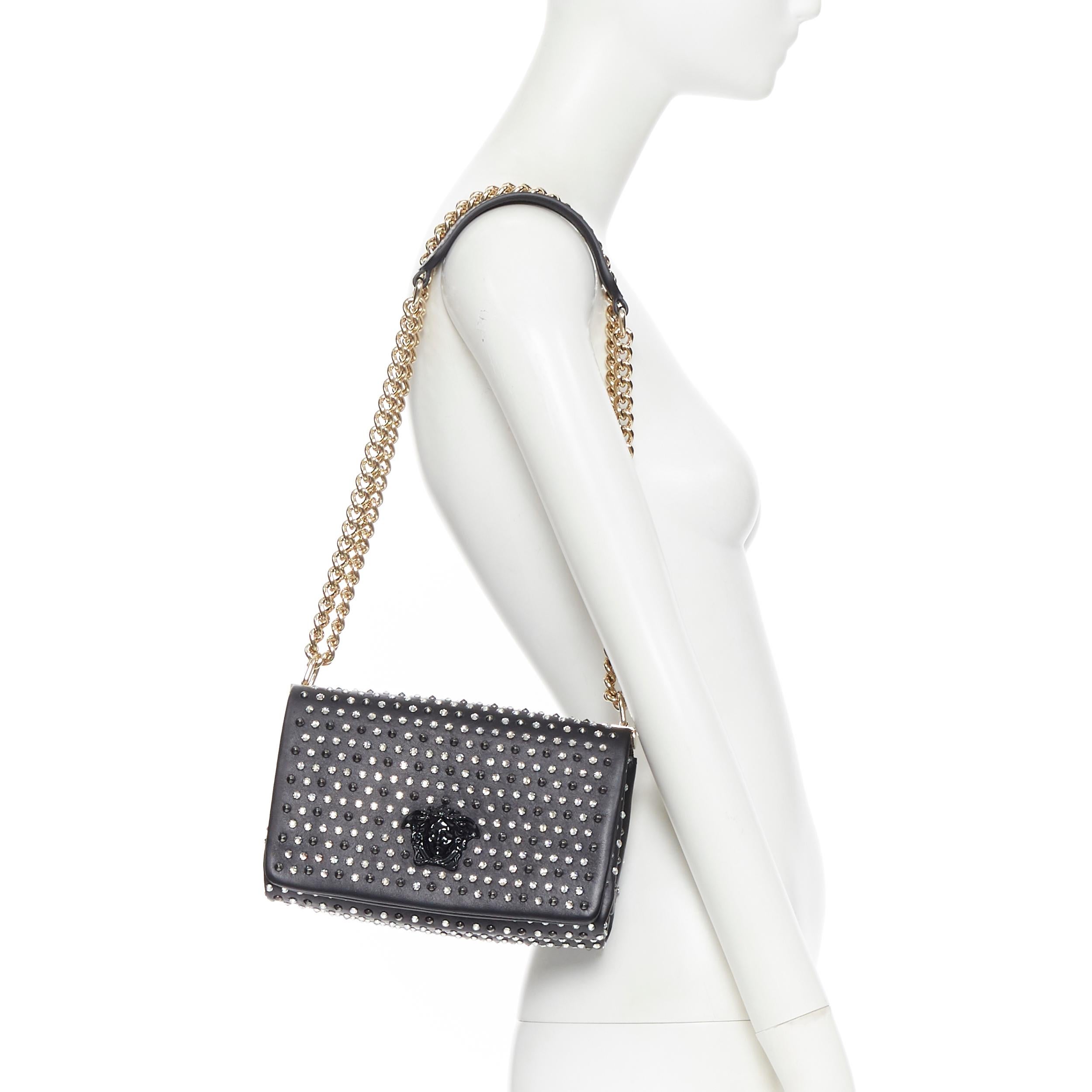 new VERSACE Palazzo Medusa black calf strass crystal spike stud shoulder bag
Brand: Versace
Designer: Donatella Versace
Model Name / Style: Palazzo Medusa flap
Material: Leather
Color: Black
Pattern: Solid
Closure: Magnetic
Extra Detail: Feature