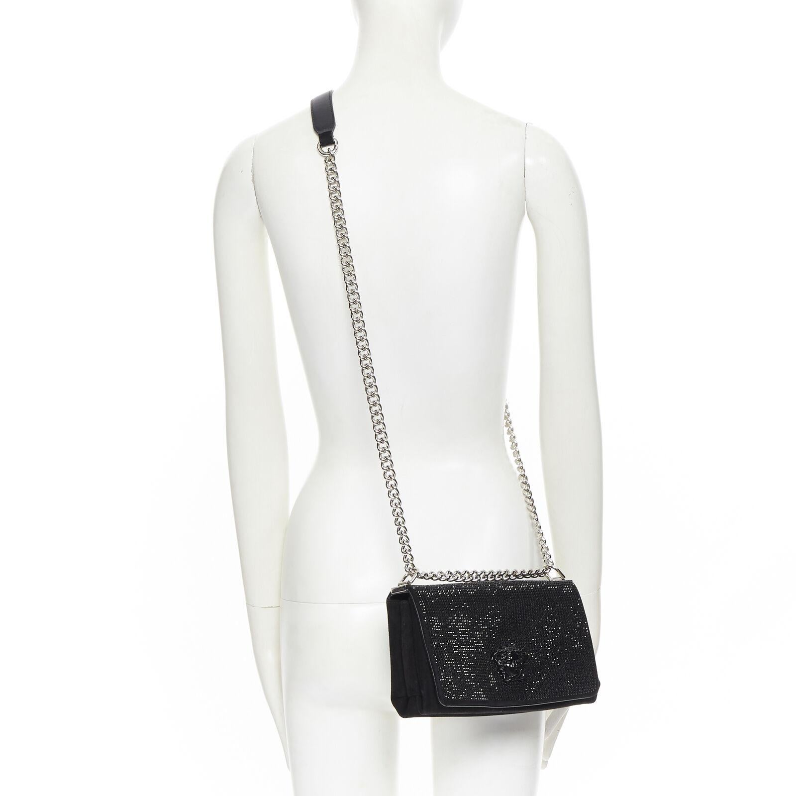 VERSACE 

Palazzo Medusa black strass embellished flap silver chunky chain bag
Brand: Versace
Designer: Donatella Versace
Model Name / Style: Palazzo Medusa Strass
Material: Leather; calf
Color: Black
Pattern: Solid
Closure: Magnetic
Extra Detail:
