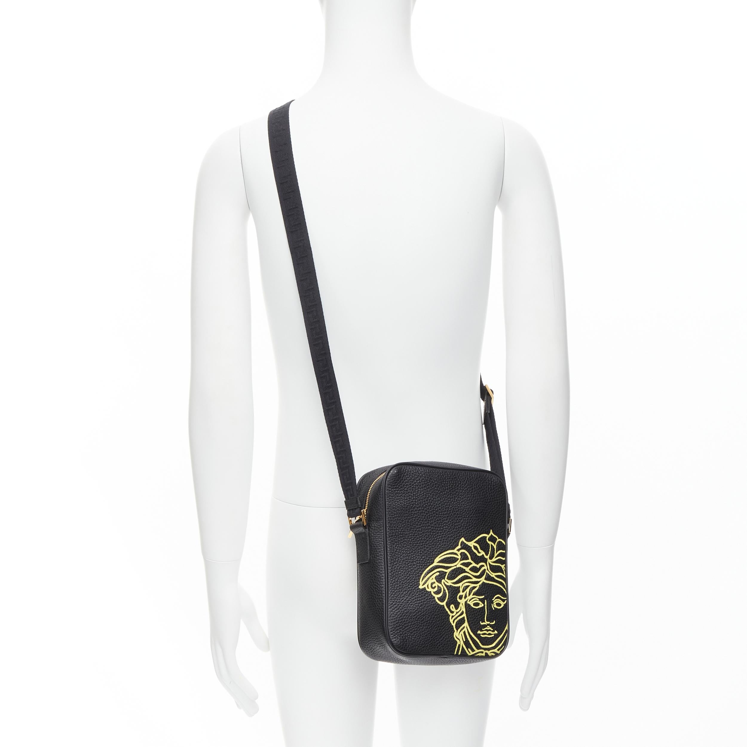 new VERSACE Pop Medusa black yellow calf Greca nylon strap crossbody bag 
Reference: TGAS/C00048 
Brand: Versace 
Designer: Donatella Versace 
Model: DL28085 DVTG4M DNZ5H 
Collection: Pop Medusa 
Material: Leather 
Color: Black 
Pattern: Solid