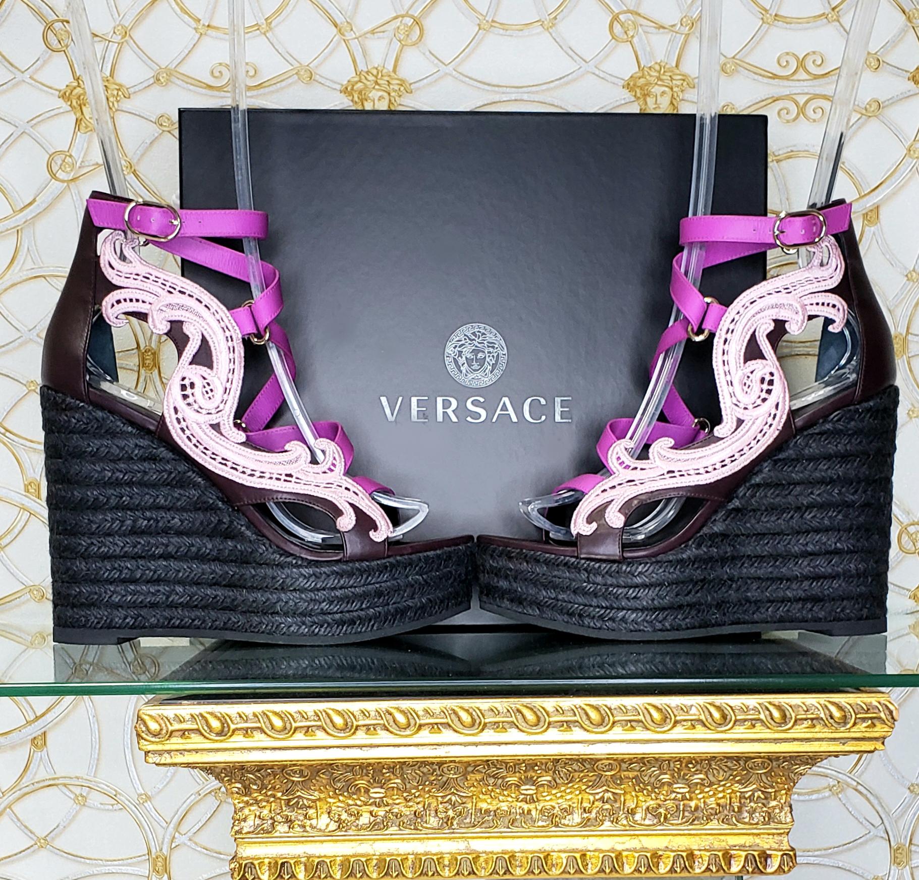 VERSACE 

 Platform SANDALS Versace's Purple Wedge Heels are guaranteed to make heads turn

 Color: Purple/black with pink lace

Gold-plated hardware

Buckling ankle strap closure, round toe line

 Rope wedge

 Leather lining

 Rubber sole


wedge's