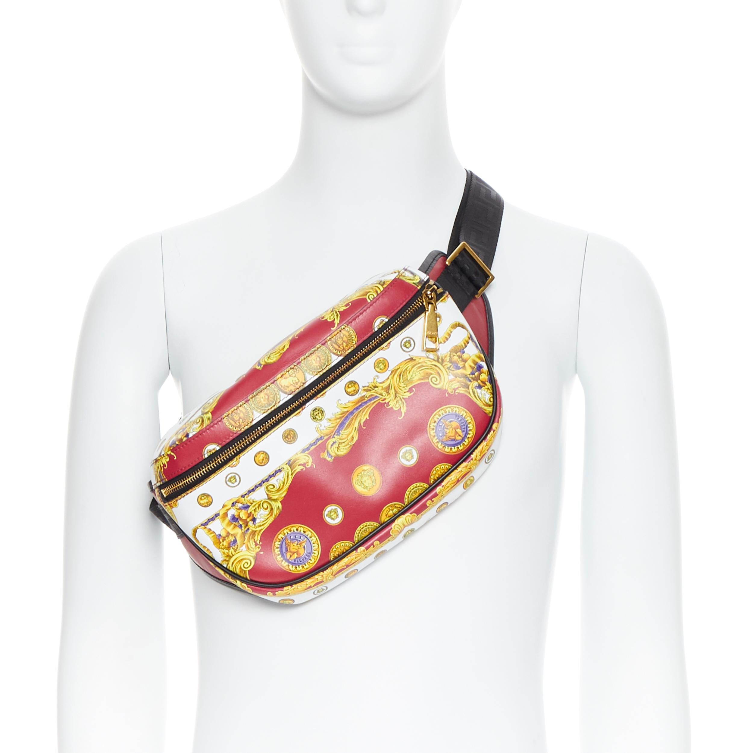 new VERSACE rare Medusa Pig Medallion coin baroque print leather waist bag 
Brand: Versace
Designer: Donatella Versace
Collection: 2019
Model Name / Style: Leather waist bag
Material: Leather
Color: Red
Pattern: Abstract
Closure: Zip
Lining