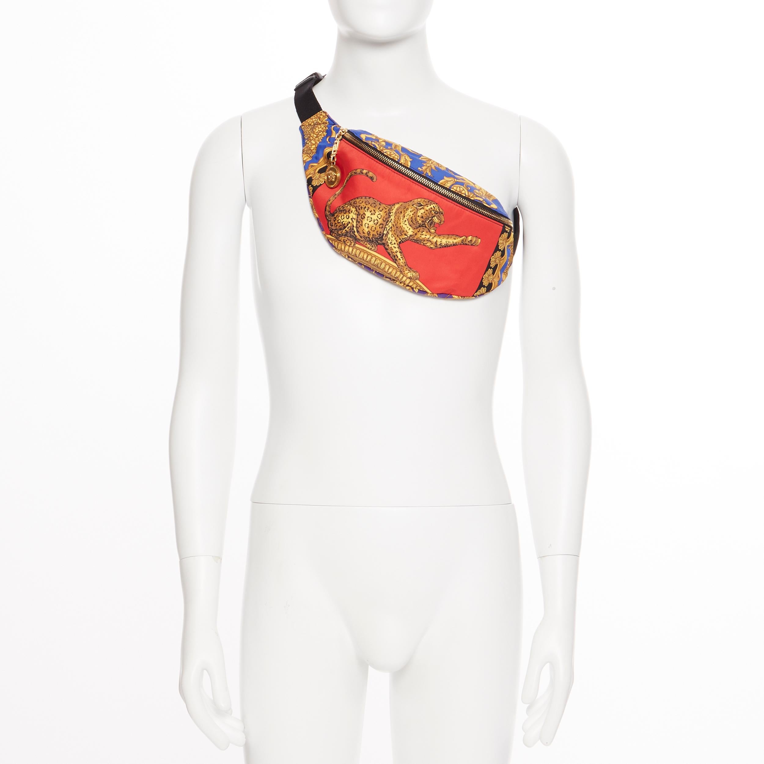 new VERSACE Red Leopard baroque printed cotton Medusa charm zip waist belt bag
Brand: Versace
Designer: Donatella Versace
Model Name / Style: Belt bag
Material: Cotton
Color: Red; blue and gold print
Pattern: Animal Print
Closure: Zip
Extra Detail: