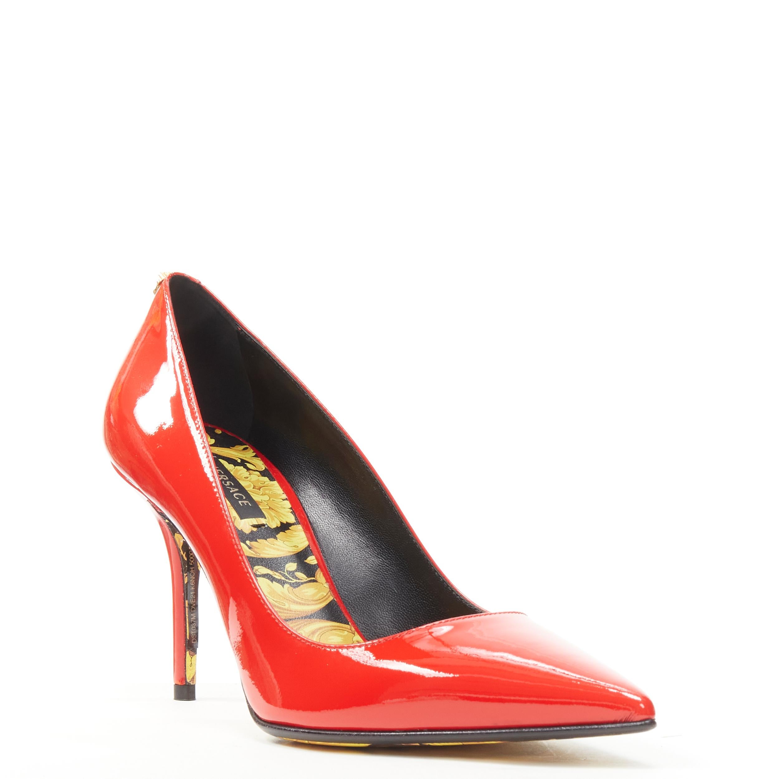 new VERSACE red patent gold Medusa stud Barocco Hibiscus sole pump EU37.5 US7.5 
Reference: TGAS/C00365 
Brand: Versace 
Designer: Donatella Versace 
Model: DST037M DVE21 K5NOH RED BAROCCO SOLE 
Material: Patent Leather 
Color: Red 
Pattern: Solid