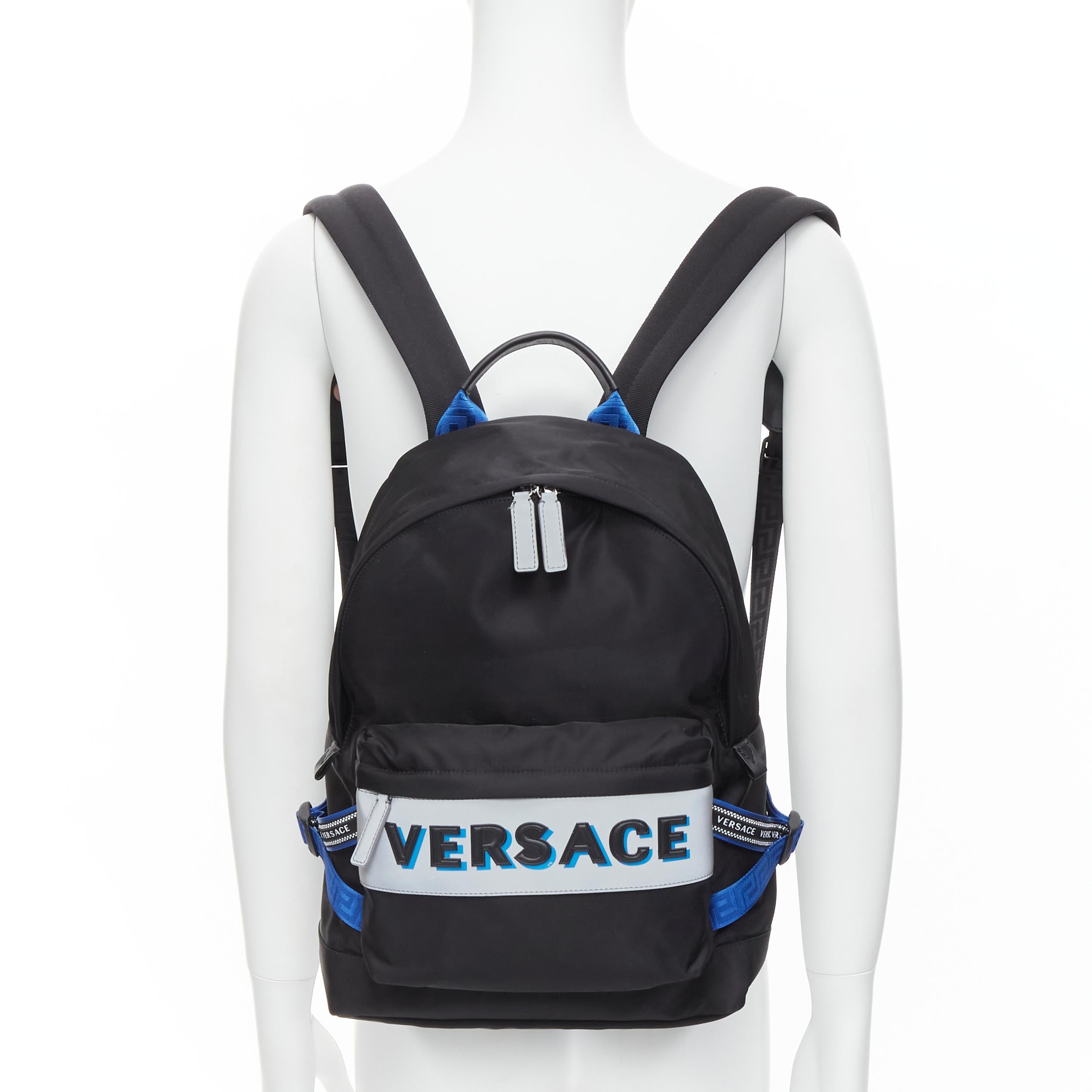 new VERSACE Reflective Logo black nylon blue Greca nylon strap backpack 
Reference: TGAS/C00026 
Brand: Versace 
Designer: Donatella Versace 
Model: DFZ8069 DNY2R K046E 
Material: Nylon 
Color: Black 
Pattern: Solid 
Closure: Zip 
Extra Detail: