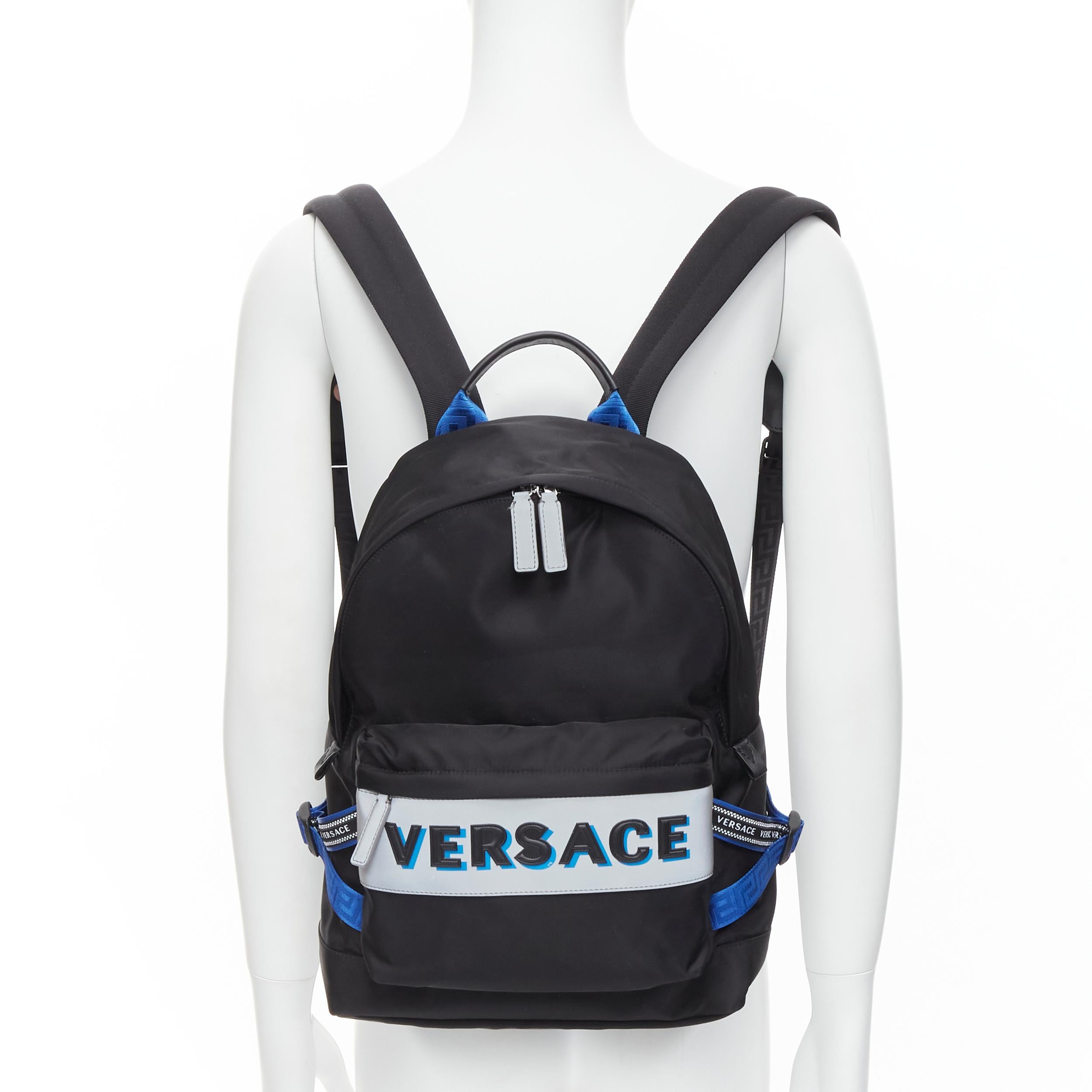 new VERSACE Reflective Logo black nylon blue Greca nylon strap backpack 
Reference: TGAS/C00083 
Brand: Versace 
Designer: Donatella Versace 
Model: DFZ8069 DNY2R K046E 
Material: Nylon 
Color: Black 
Pattern: Solid 
Closure: Zip 
Extra Detail: