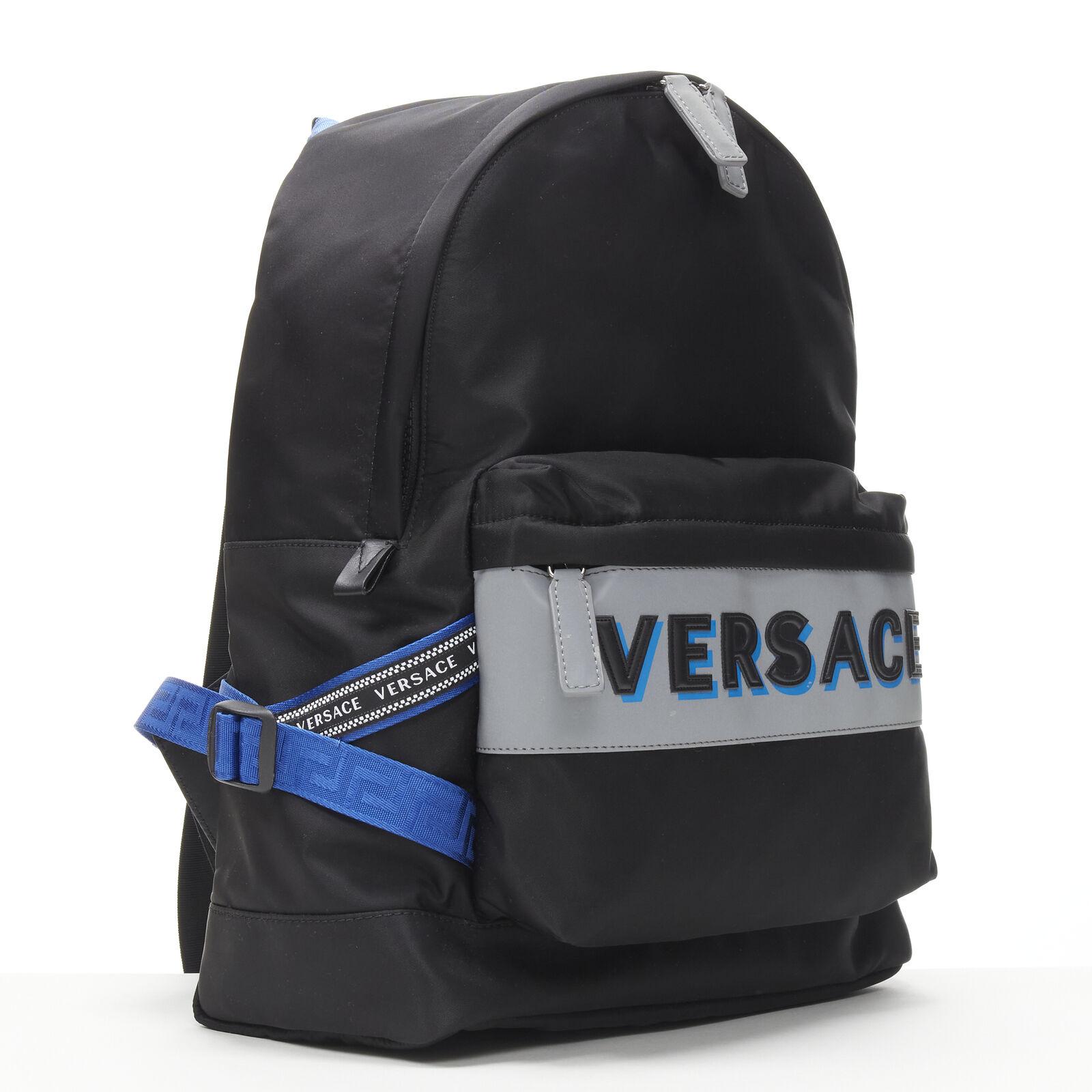 new VERSACE Reflective Logo black nylon blue Greca nylon strap backpack
Reference: TGAS/C00027
Brand: Versace
Designer: Donatella Versace
Model: DFZ8069 DNY2R K046E
Material: Nylon
Color: Black, Blue
Pattern: Solid
Closure: Zip
Lining: Nylon
Extra